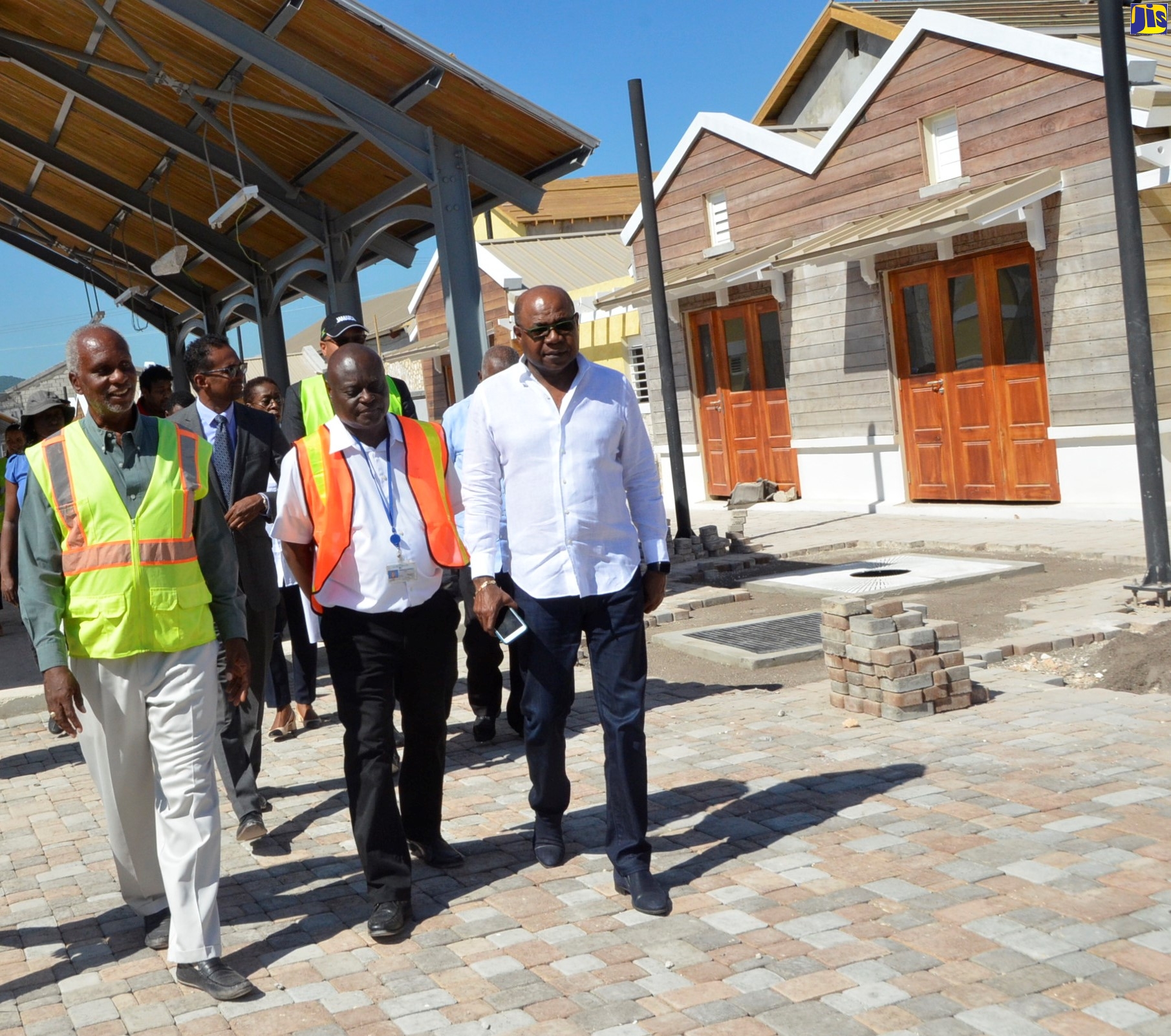 Minister of Tourism, Hon. Edmund Bartlett (right), tours the site of the Hampden Wharf Artisan Village in Falmouth, Trelawny, on Thursday (October 17). Also on the tour were (from left): Director of Projects, Surrey Paving and Aggregate Company Limited, Michael Archer; Executive Director of the Tourism Enhancement Fund (TEF), Dr. Carey Wallace, and Senior Vice President of Engineering and Port Development at the Port Authority of Jamaica, Mervis Edghill.