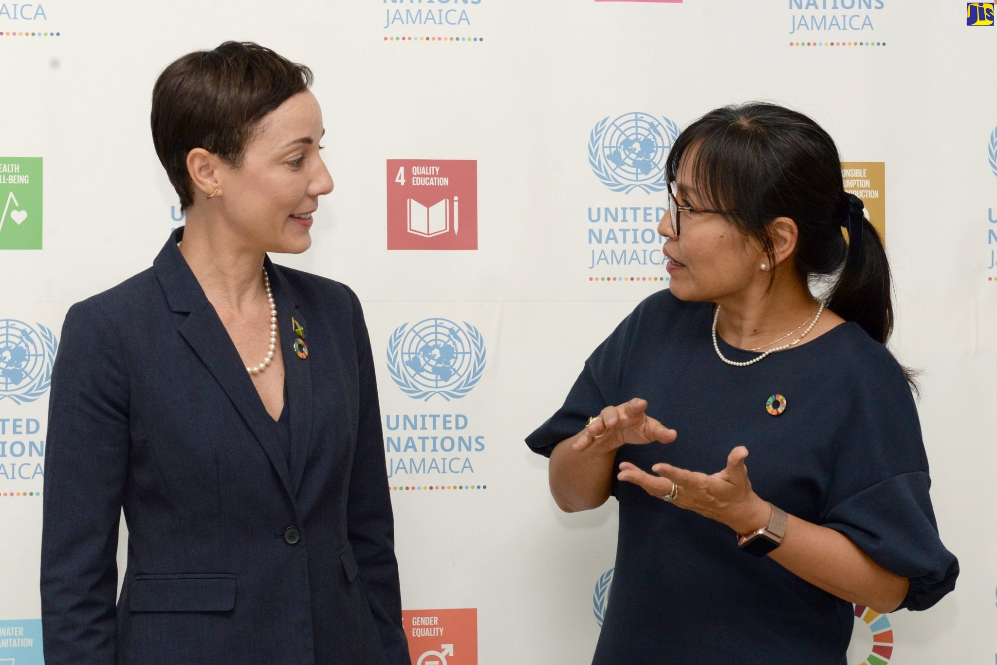 Minister of Foreign Affairs and Foreign Trade, Senator the Hon. Kamina Johnson Smith (left), speaks with United Nations Resident Coordinator, Mariko Kagoshima, at a United Nations Day 2019 ceremony, at the Courtleigh Auditorium in Kingston, on Thursday (October 24).