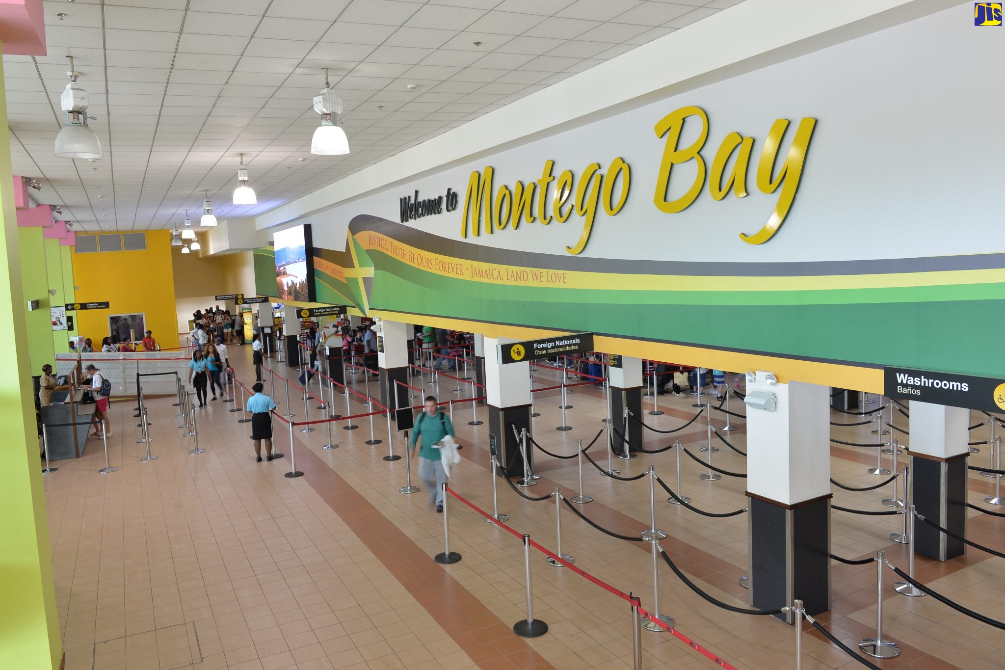 : Arriving passengers enter the immigration hall of the Sangster International Airport.