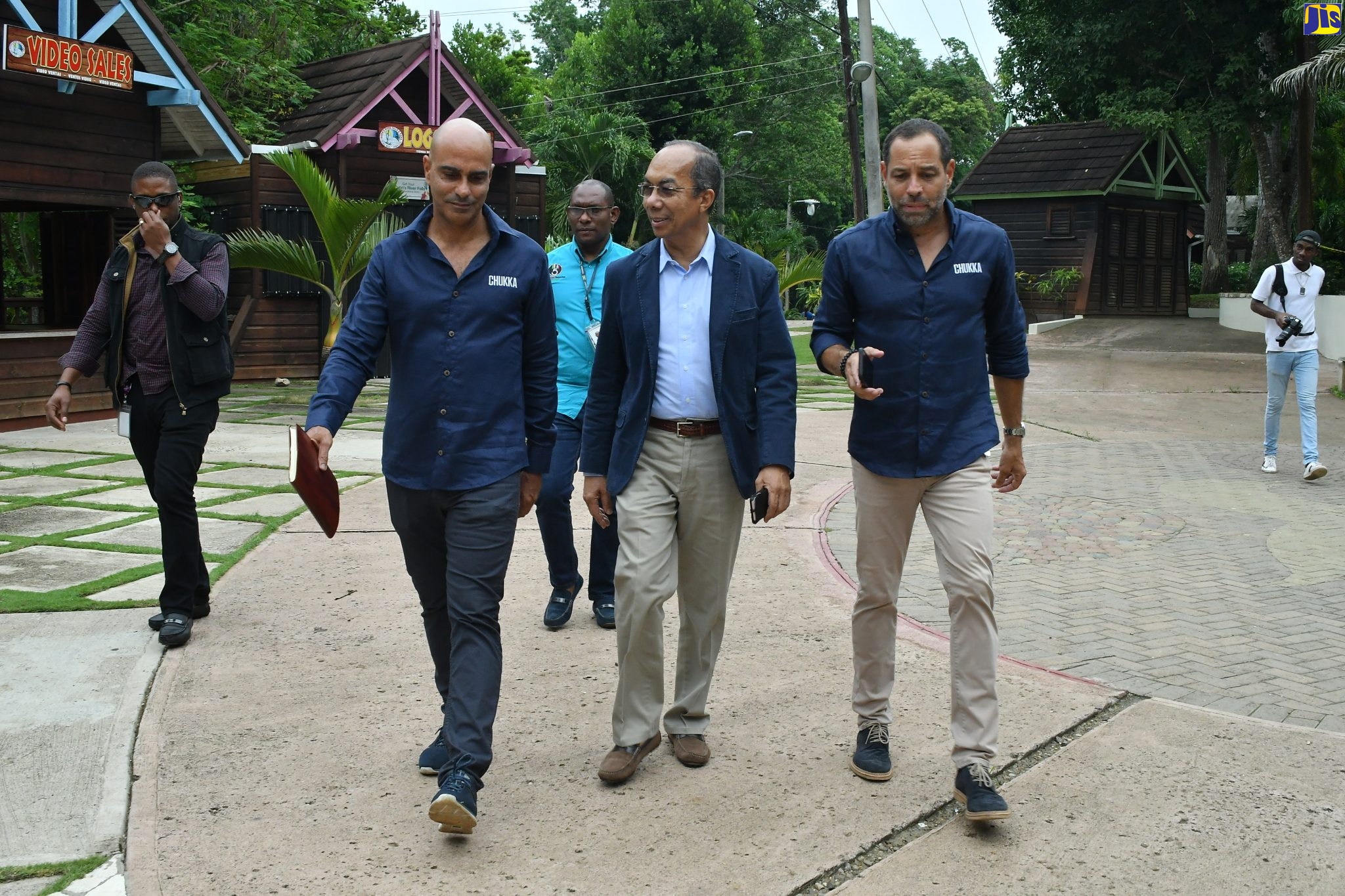 National Security Minister, Hon. Dr. Horace Chang (second right), is escorted by Chukka Caribbean Adventures’ Executive Director, John Byles (second left), and Chief Executive Officer, Marc Melville (right), on arrival at the launch of the ‘Zip Line over Dunn’s River’ attraction at Dunn’s River Falls in Ocho Rios, St. Ann, on October 4.