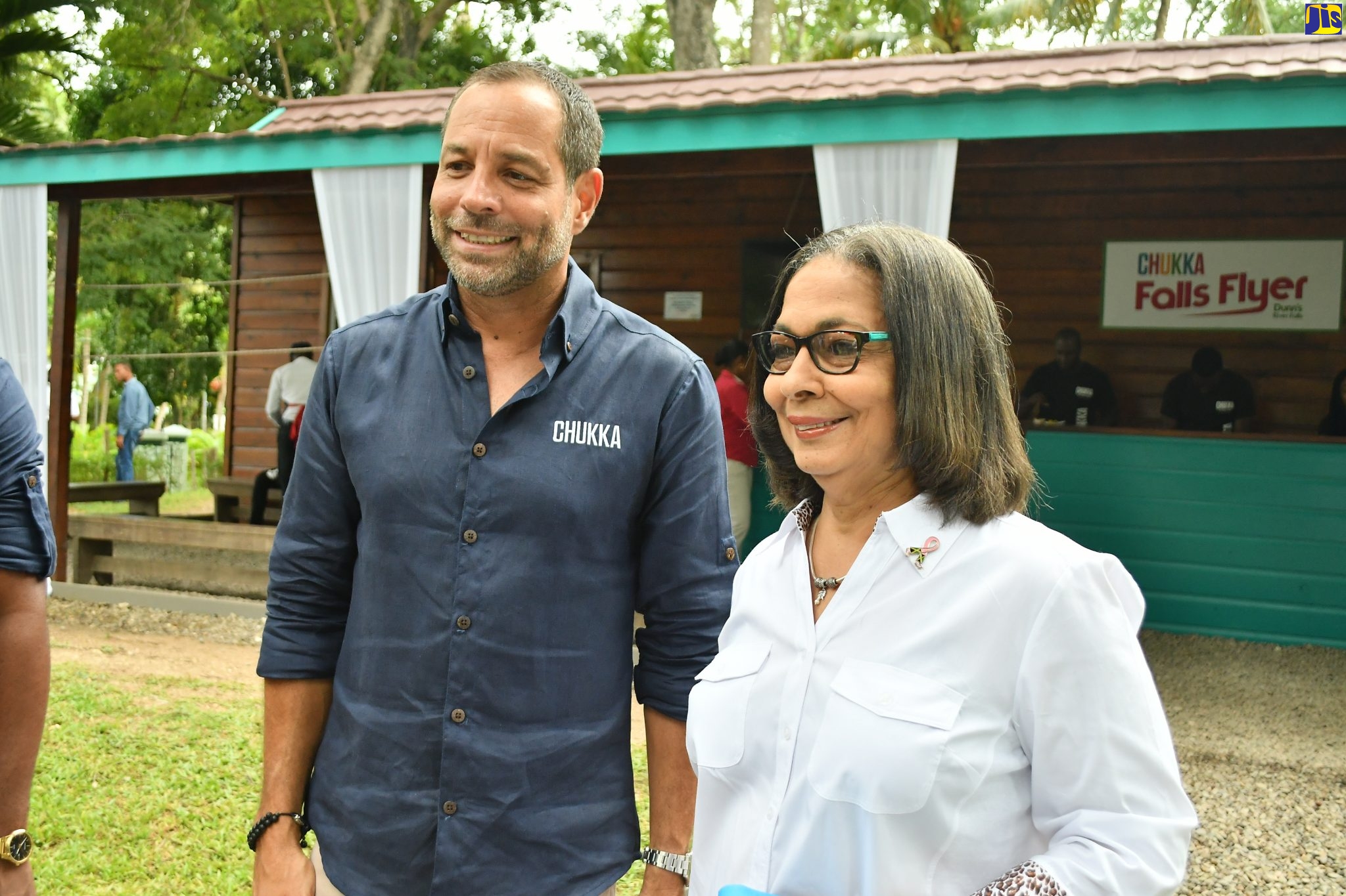 Minister of Labour and Social Security, and Member of Parliament for North East St. Ann, Hon. Shahine Robinson (left), with Chukka Caribbean Adventures CEO, Marc Melville, at the Zip Line over Dunn’s River launch at Dunn’s River Falls on October 4.