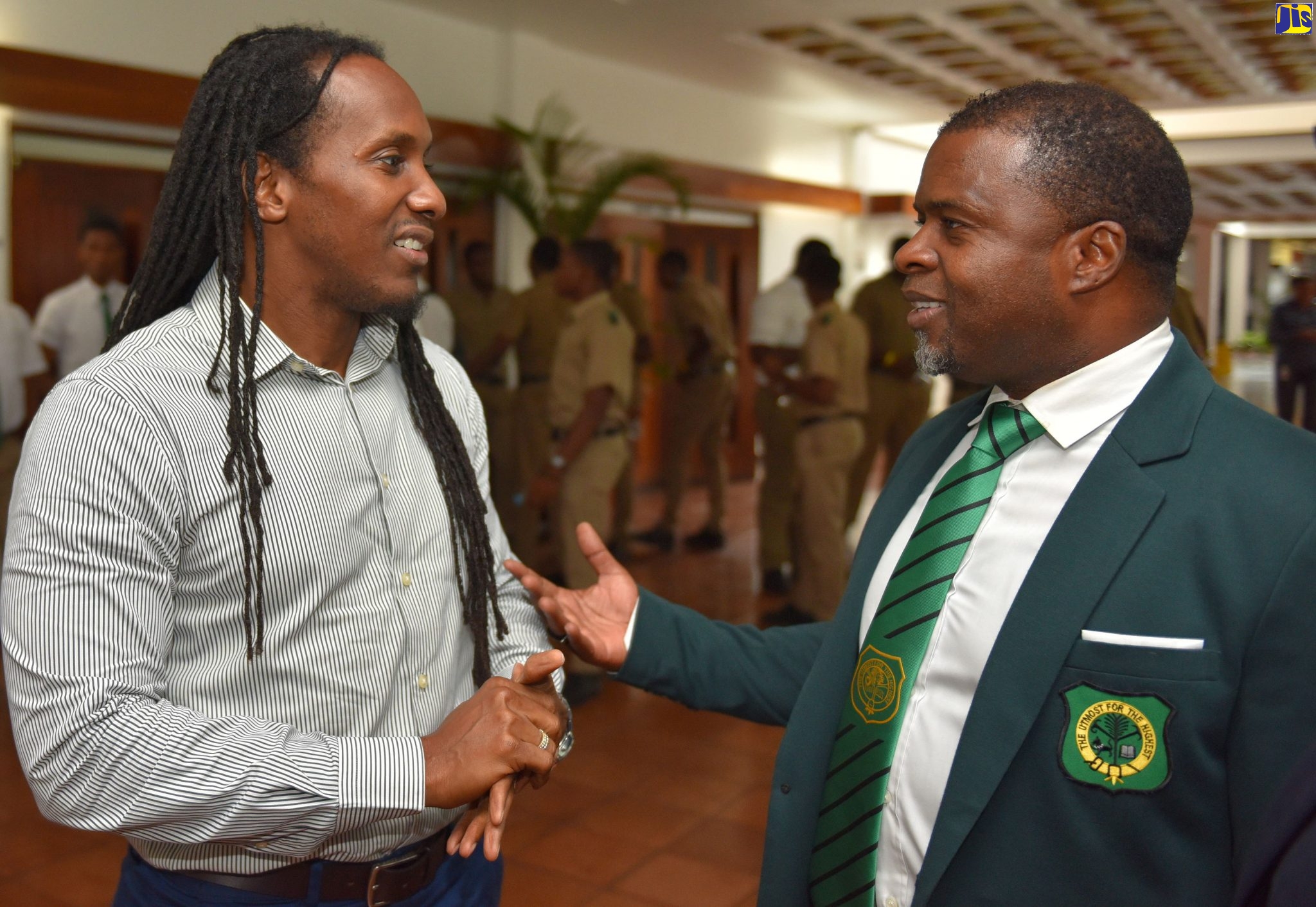 Minister of State in the Ministry of Education, Youth and Information, Hon. Alando Terrelonge (left), engages in conversation with  and Organiser, Calabar Old Boys’ Association