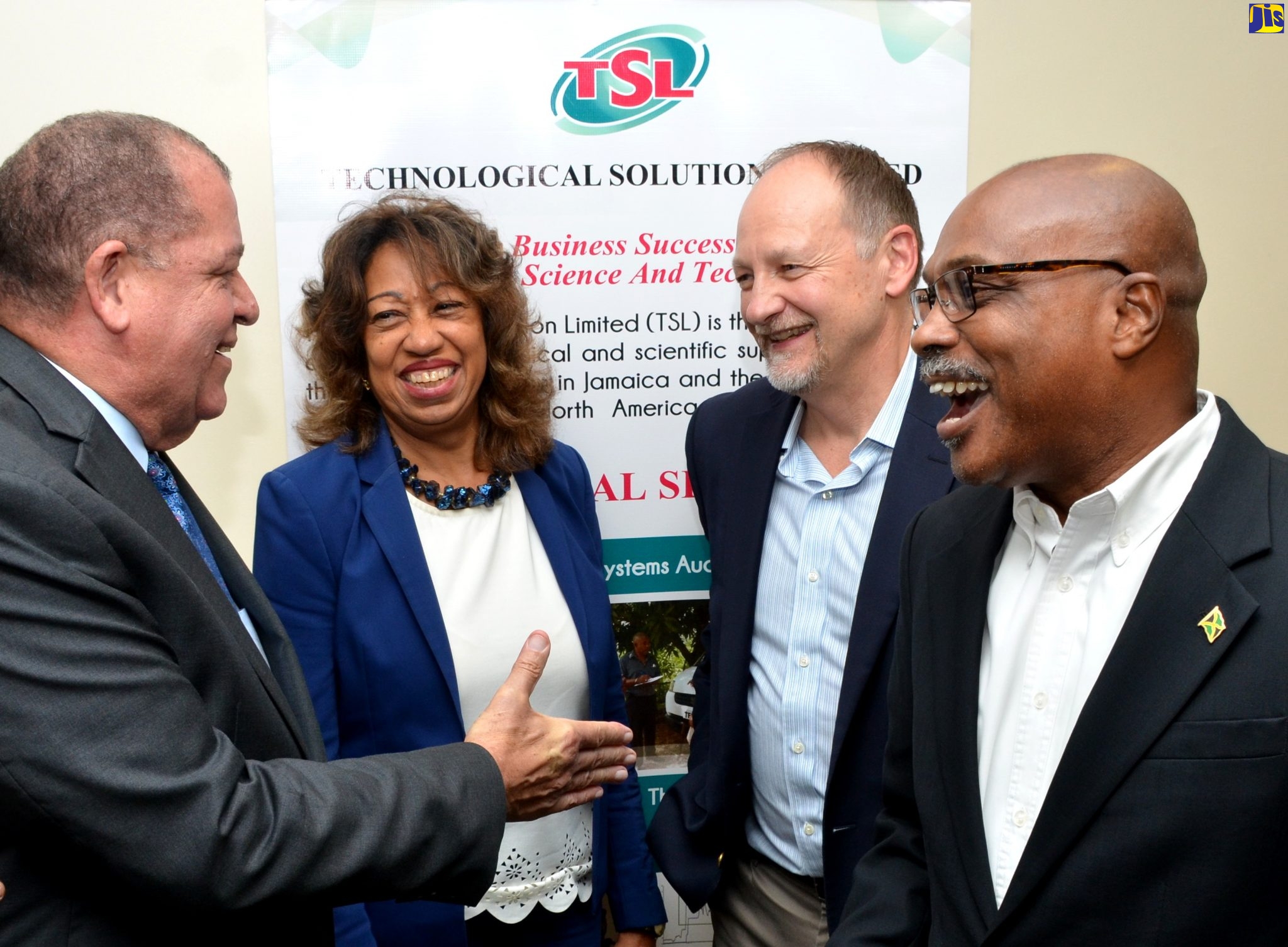 Minister of Industry, Commerce, Agriculture and Fisheries, Hon. Audley Shaw (left), engages in a light moment with (from second left), President, Jamaica Promotions Corporation (JAMPRO), Diane Edwards; Senior representative, Safe Quality Food Institute (SQFI), Frank Schreurs; and Chief Executive Officer (CEO), Technological Solutions Ltd.(TSL), Dr. André Gordon. Occasion was the opening of the TSL’s  Safe Quality Food (SQF) training seminar series at the Courtleigh Hotel and Suites in New Kingston on Monday (October 14).