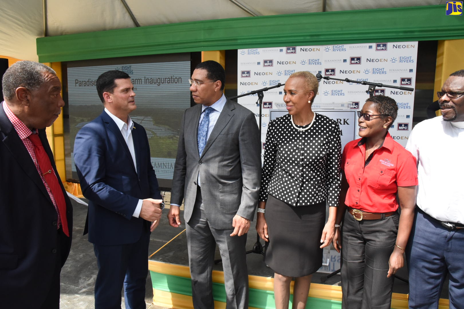 Prime Minister, the Most Hon. Andrew Holness (third left), listens keenly to a point being made by Jamaica Public Service (JPS) President, Emanuel DaRosa (second left), at the inauguration of the Paradise Park Solar Farm in Savanna-la-Mar, Westmoreland, on October 2. Looking on are (L to R) Mayor of Savanna-la-Mar, His Worship Bertel Moore; Minister of Science, Energy and Technology, Hon. Fayval Williams; Deputy Director General of the Office of Utilities Regulation (OUR) Cheryl Lewis; and Custos of Westmoreland, Reverend Canon Hartley Perrin.