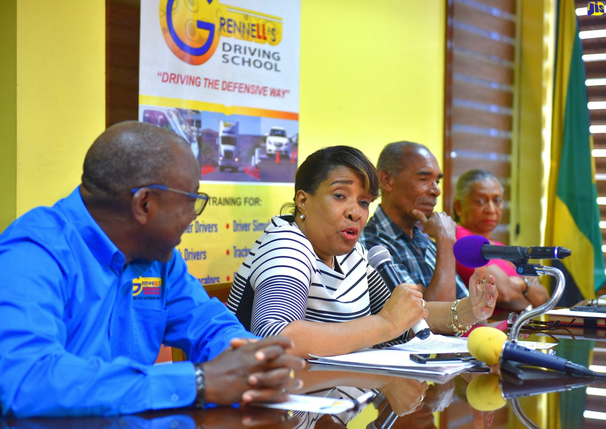 Executive Director of the National Road Safety Council (NRSC), Paula Fletcher (2nd left), addresses the launch of the 9th staging of Grennell’s Road Safety 5k race, at the Ministry of Transport and Mining, Maxfield Avenue,  in St. Andrew, on November 1. Listening (from left) are:  Chairman of the event, Alphonso Grennell, father of Jason Alliman, who lost his life in a motor vehicle collision; Errol Alliman, and  Claudia Alliman.