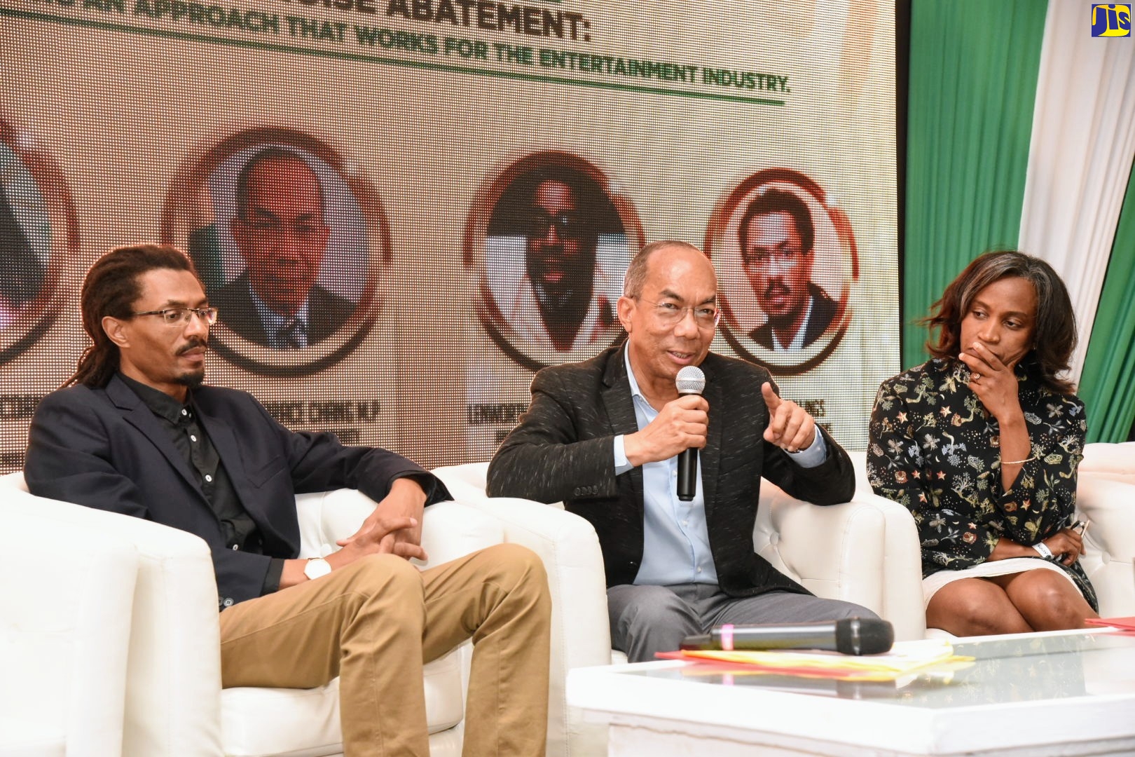 National Security Minister, Hon. Dr. Horace Chang (centre), makes a point during a Jamaica Music Society (JMS) music seminar at the Spanish Court Hotel, in New Kingston on Friday (November 15). Others (from left) are: JMS General Manager, Evon Mullings (left); and Senior Director at the Ministry of Culture, Gender and Sport, Gillian Wilkinson-McDaniel.