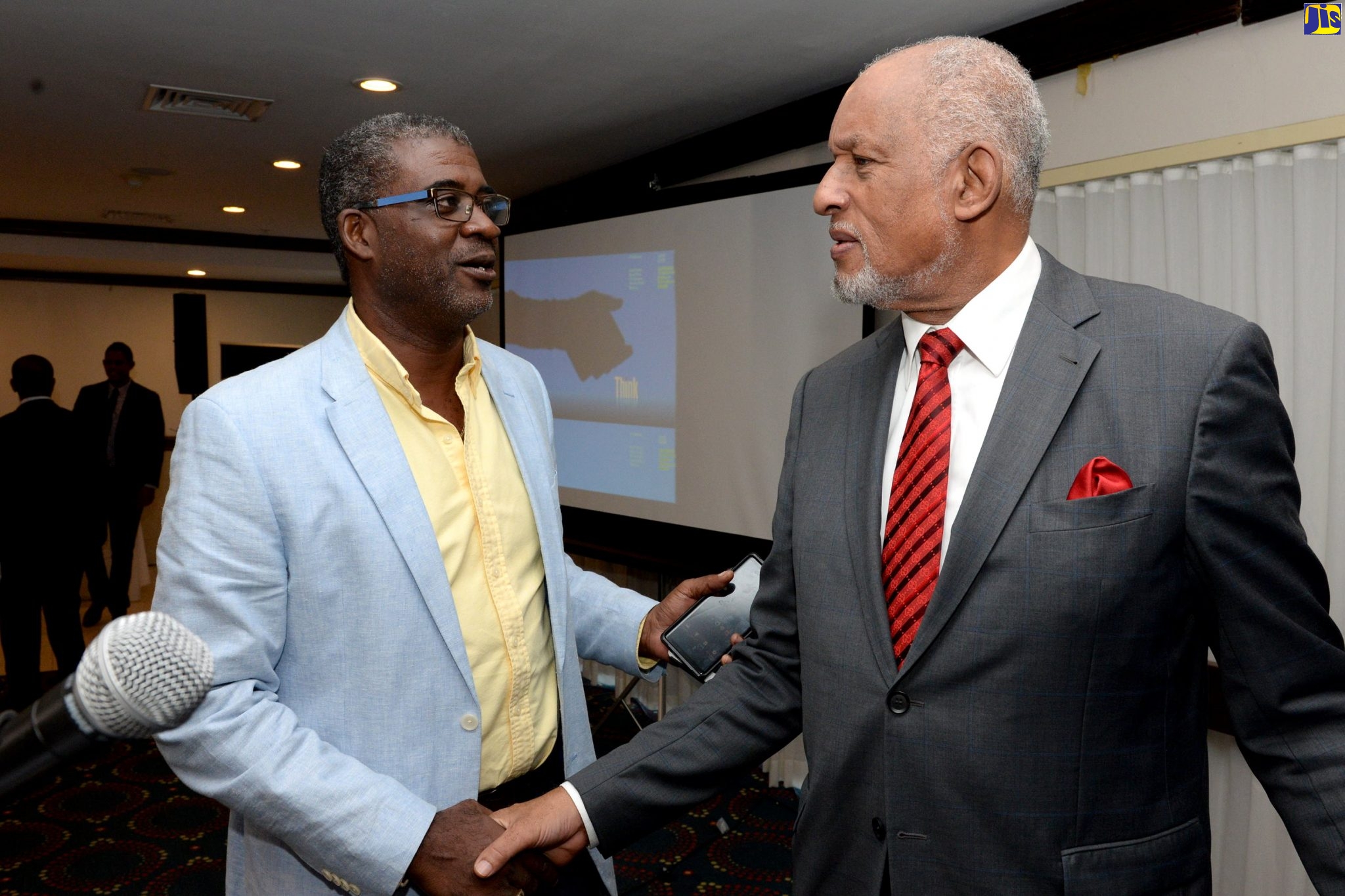 Cabinet Secretary and Head of the Civil Service, Ambassador Douglas Saunders (right), greets member of the Registrar General’s Department’s Audit Committee, Derron Dixon, during the 14th annual Government of Jamaica Audit Committees’ Conference, at the Jamaica Pegasus Hotel in New Kingston, on Thursday (November 7). The event was jointly hosted by the Ministry of Finance and the Public Service and Cabinet Office under the theme: ‘Fit for Purpose: Audit Committees Improving Accountability and Promoting Governance’.