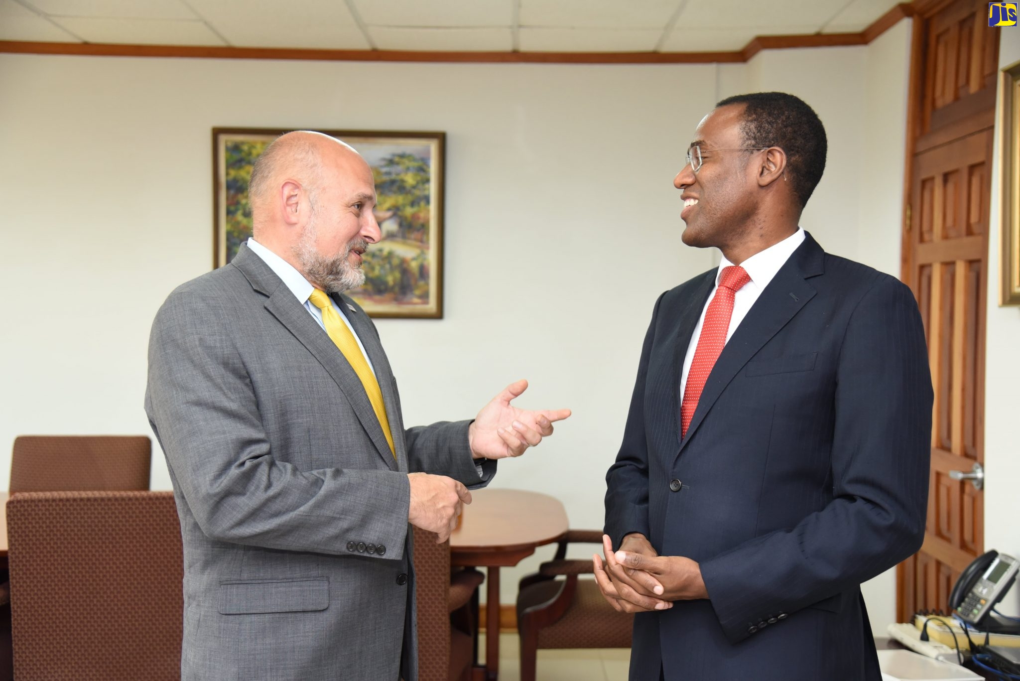 Minister of Finance and the Public Service, Dr. the Hon. Nigel Clarke (right), speaks with Assistant Administrator for Latin America and Caribbean Bureau, USAID/Washington, John Barsa, during a courtesy call at the Ministry of Finance and the Public Service, on Thursday (October 31).