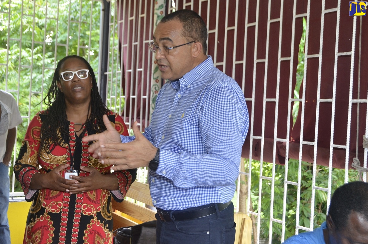 Minister of Health and Wellness, Dr. the Hon. Christopher Tufton, in discussion with Regional Psychiatrist at the Western Regional Health Authority (WHRA), Lisabeth Crossman, during a visit to the Committee for the Upliftment of the Mentally Ill (CUMI) Rehabilitation Centre, in Montego Bay, St. James, on Thursday (October 24).