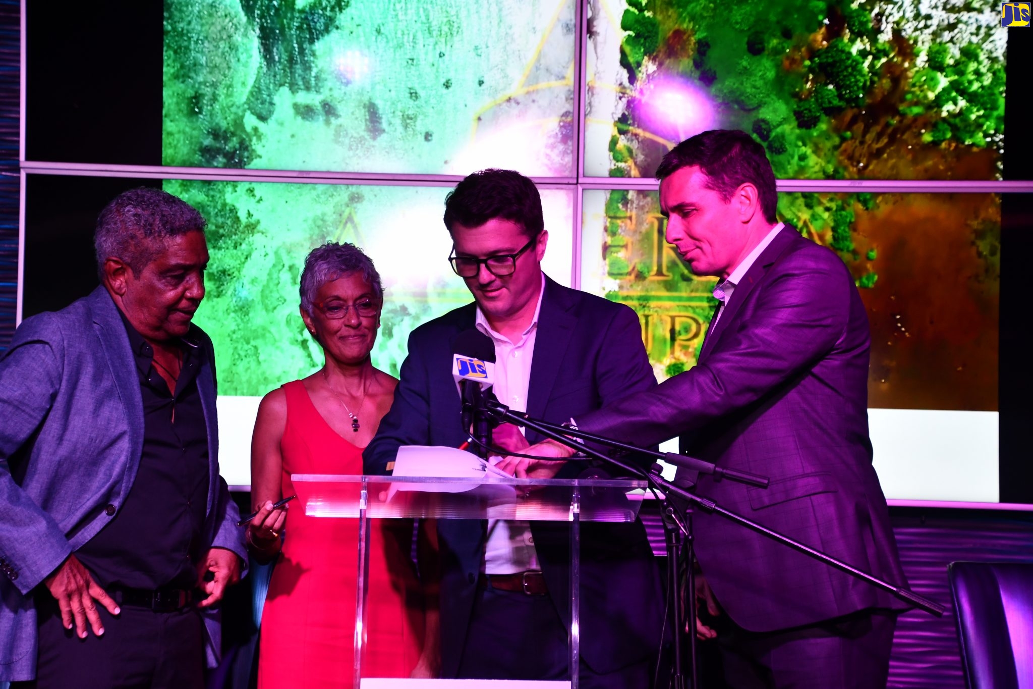 Amaterra Jamaica Group Chairman, Keith Russell (left), and Director, Paula Russell (second left), observe the formalities during Wednesday’s (November 13) signing of a hotel management agreement with Marriott International, being undertaken by the latter entity’s Chief Development Officer for the Caribbean and Latin America, Laurent De Kousemaker (second right), and Vice President, Brojan Kumer, at the Hard Rock Café in Montego Bay, St. James.