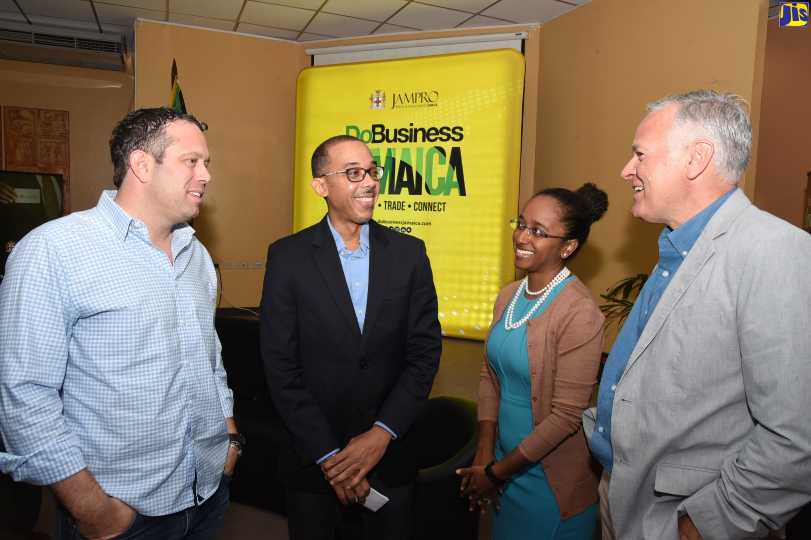 Jamaica Promotions Corporation (JAMPRO) Vice President for Research, Advocacy and Project Implementation, Shullette Cox, (second right), in discussion with (from left) Founder and Chief Executive Officer, ItelBPO, Yoni Epstein; National Outsourcing Coordinator, JAMPRO, Roger Williams; and Director, Nearshore Americas, Kirk Laughlin.
