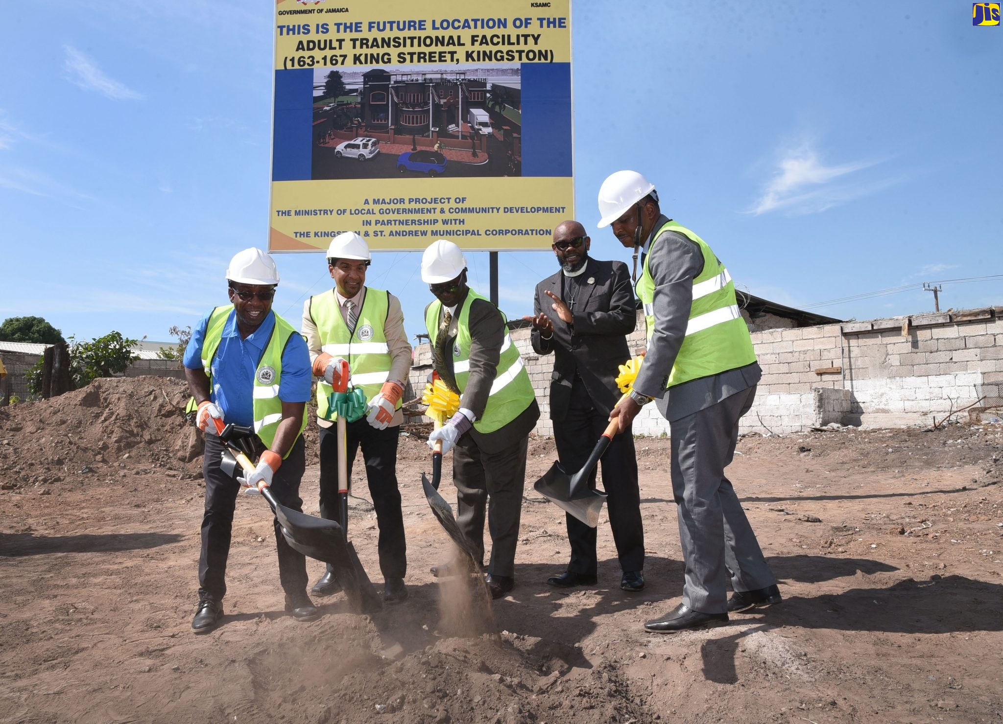 Minister of Local Government and Community Development, Hon. Desmond McKenzie (centre), breaks ground for construction of a state-of-the-art Adult Transitional Facility for the homeless in Kingtson on Monday (November 11). Others participating in the ground-breaking (from left) are Minority Leader at the Kingston and St. Andrew Municipal Corporation (KSAMC), Andrew Swaby; Mayor of Kingston, Senator Delroy Williams; Senior Pastor at the Webster Memorial Church, Rev.  Astor Carlye; and Managing Director of the Jamaica Social Investment Fund (JSIF), Omar Sweeney.