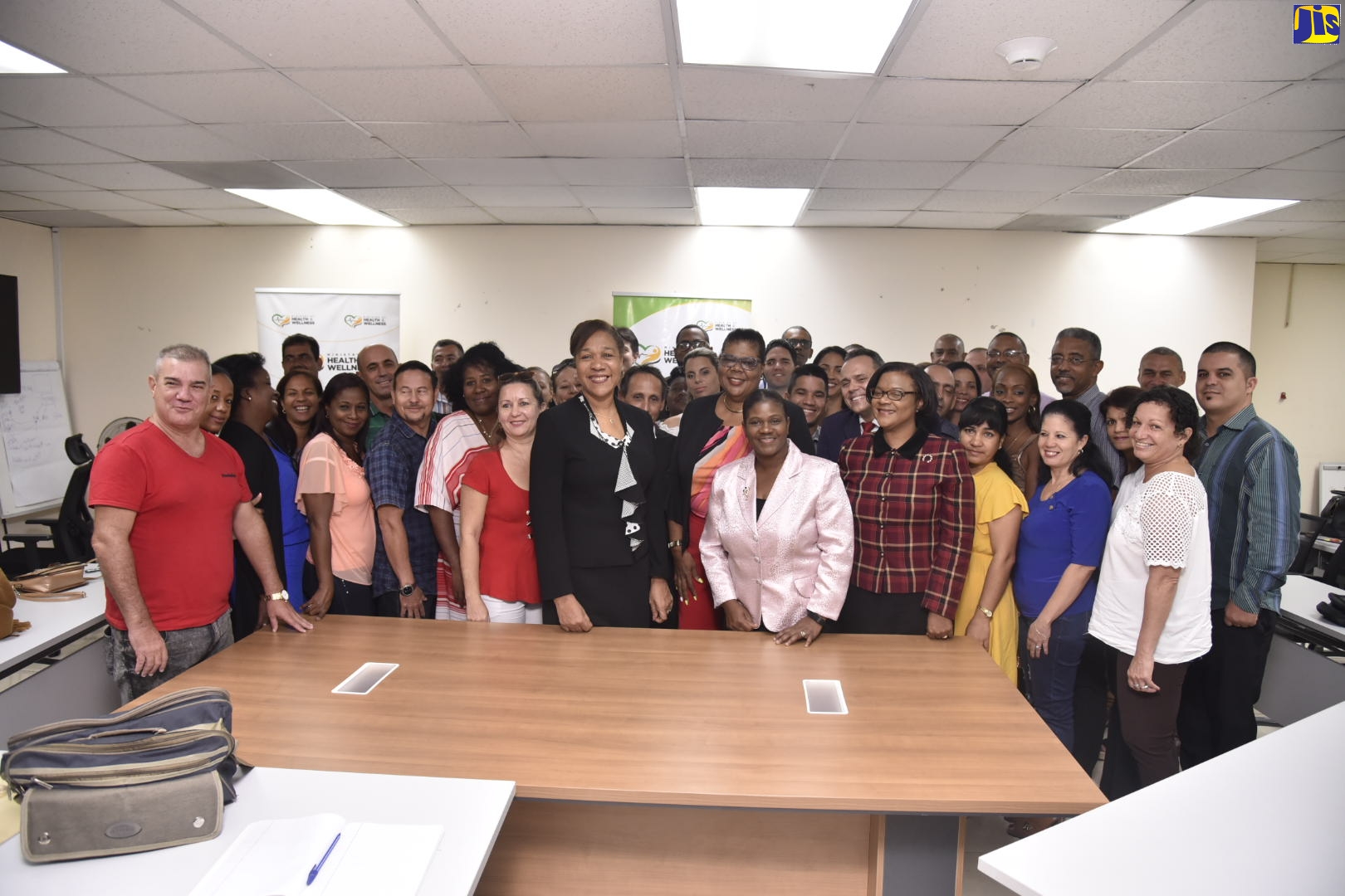 Cuban Ambassador to Jamaica, Her Excellency Inés Fors Fernández (centre), with the 40 medical professionals from her country and other officials at the Ministry of Health and Wellness. Occasion was a welcome reception for the healthcare professionals, held today (November 25), at the Ministry’s New Kingston offices in St. Andrew. The team members will be deployed across the island to bolster the public healthcare service.