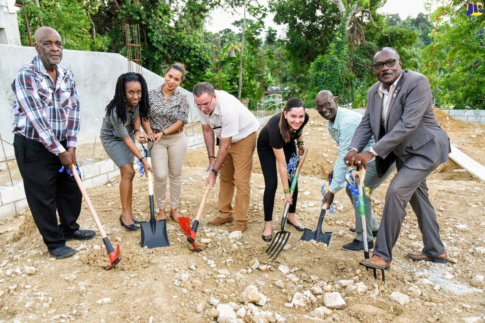 Minister of Local Government and Community Development, Hon. Desmond McKenzie (second right),  breaks ground for a new $45-million male ward at the Portland Infirmary in Port Antonio, on November 6.  Also participating (from left) are Councillor for the Port Antonio Division, Dexter Rowland; Matron at the Infirmary, Carmelita Holson; Secretary for the Board of Supervision, Treka Lewis; Member of Parliament for West Portland, Hon. Daryl Vaz;  Member of Parliament for Eastern Portland, Ann-Marie Vaz; and Mayor of Port Antonio, Paul Thompson.
