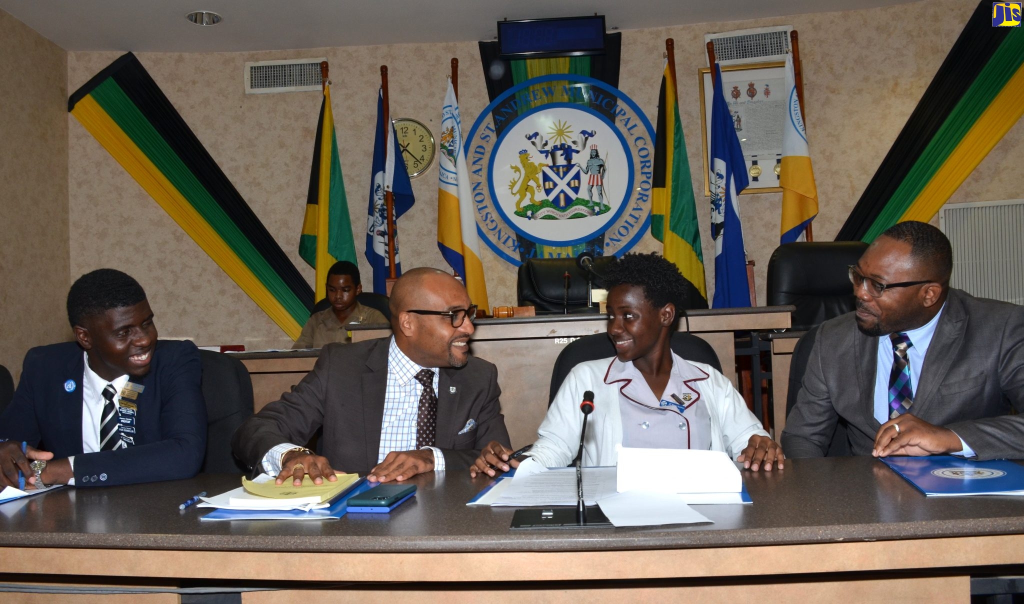 Chief Executive Officer (CEO) of the Kingston and St. Andrew Municipal Corporation (KSAMC), Robert Hill, (second left) engages with KSAMC’s Youth CEO, Danielle Jones (second right), while Youth Deputy CEO, Fabian Morris (left), and Senior Director in the Ministry of Local Government and Community Development, Junior Rose, look on. Occasion was the KSAMC 2019 Junior Council Forum at the Corporation’s Chambers in downtown Kingston on Thursday (November 14).