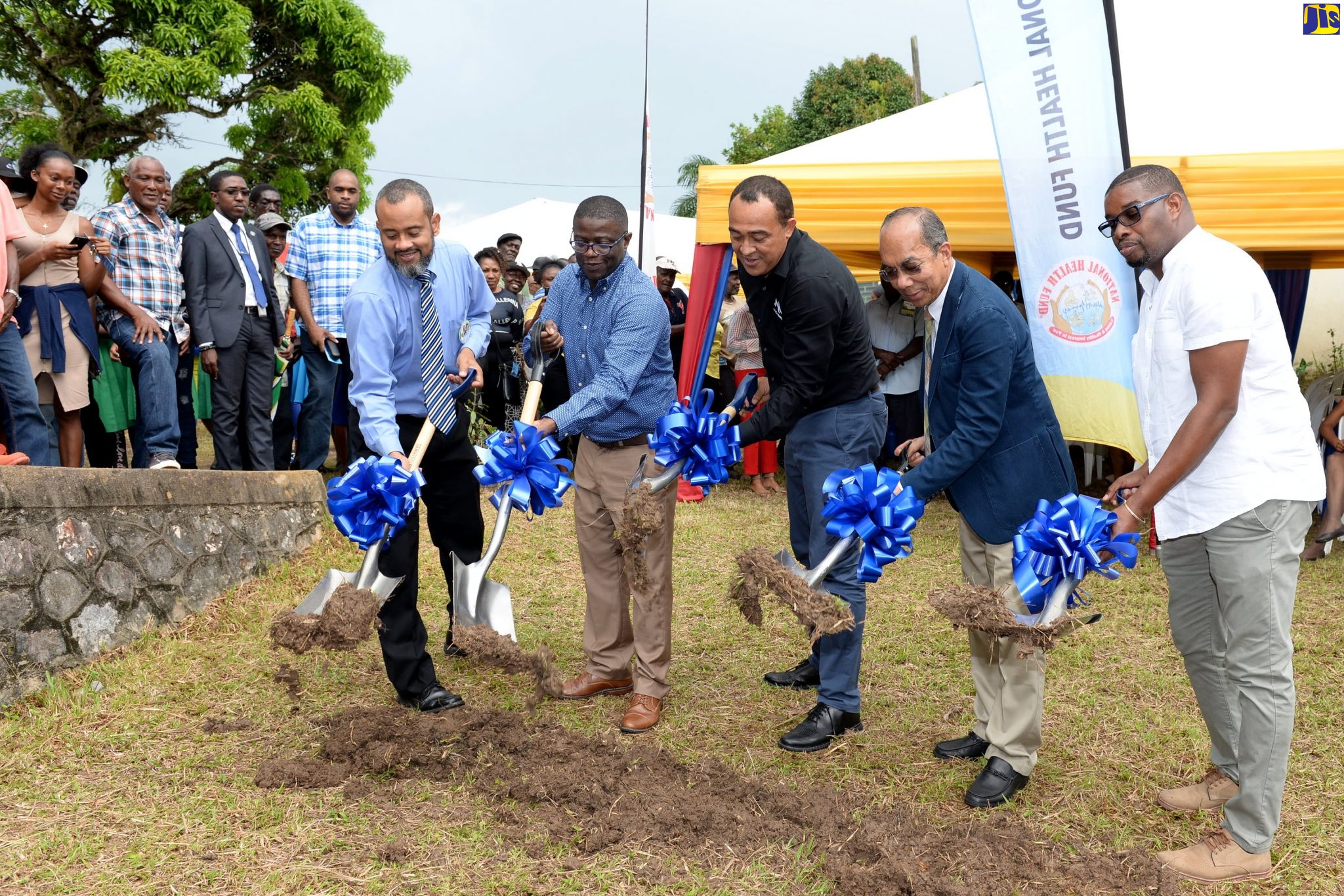 Minister of Health and Wellness, Dr. the Hon. Christopher Tufton (centre), participates in the breaking of ground for construction of the Dr. Kenneth Baugh Health Centre in Point Hill, St. Catherine, on November 6. Others (from left) are Dr. Baugh