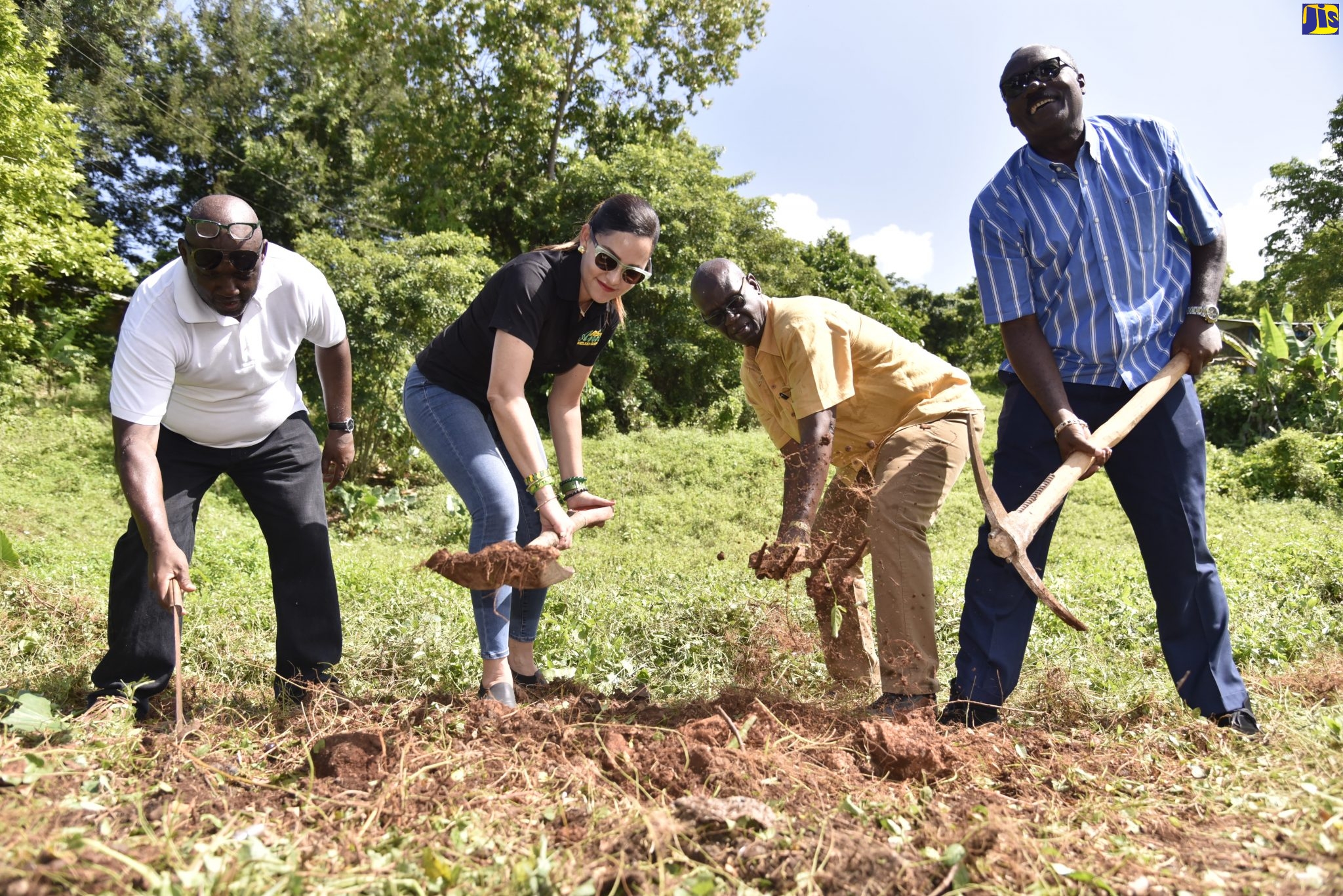 Minister of Local Government and Community Development, Hon. Desmond McKenzie (second right); participates in the breaking of ground for construction of a water shop in Commodore, Portland, on Friday (November 8). Others (from left) are Councillor, Fairy Hill Division, Derron Wood; Member of Parliament for Eastern Portland, Ann Marie Vaz and Mayor of Port Antonio, His Worship Councillor Paul Thompson.