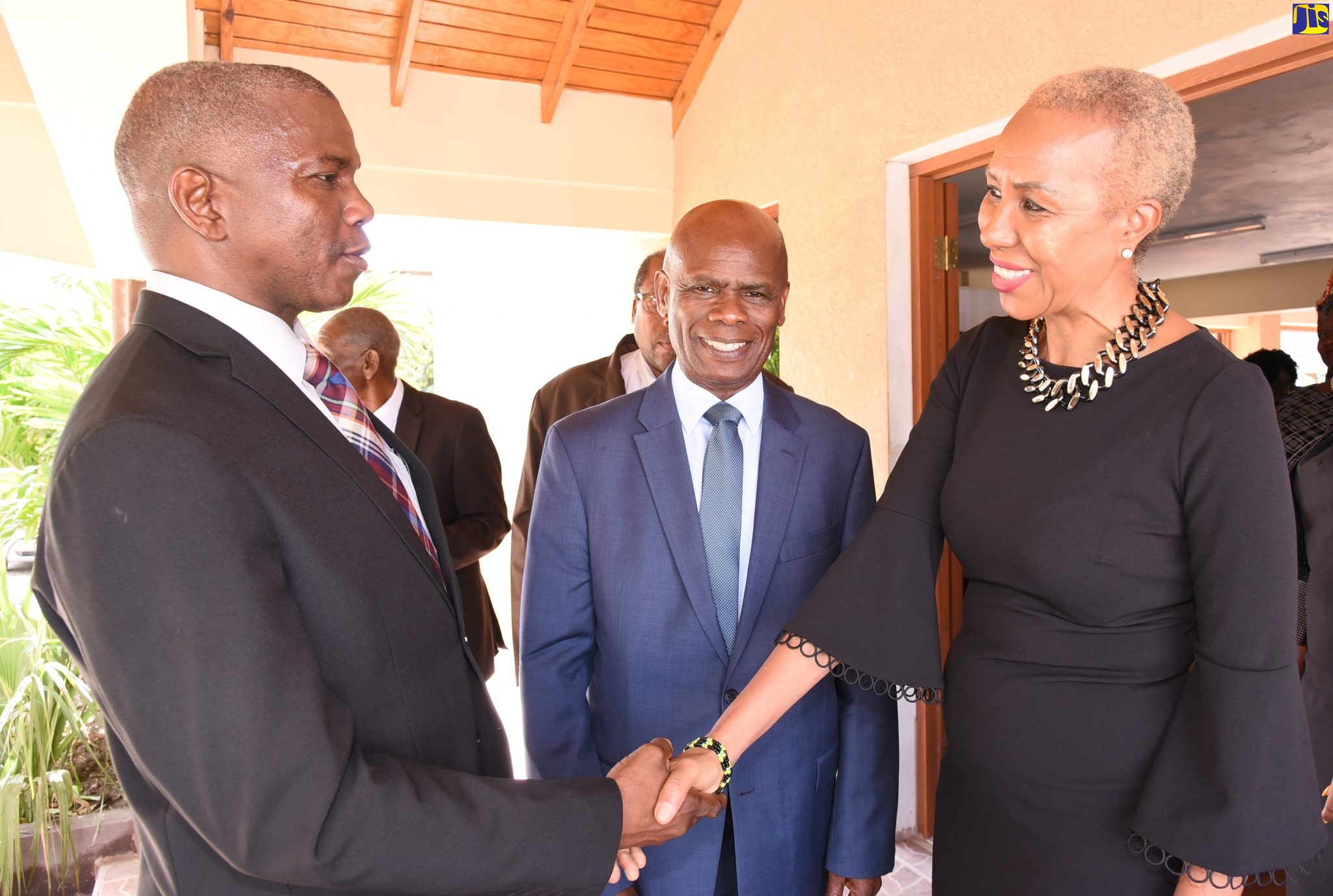 Science, Energy and Technology Minister, Hon. Fayval Williams (right), is greeted by Pastor of Olson Memorial Church of God in Kingston, Rev. Adinhair Jones, on arrival for Sunday’s (November 17) Civil Service Week church service. Looking on is Custos Rotulorum for Kingston, Hon. Steadman Fuller. The week is being observed from November 17 to 23 under the theme: ‘Building and Sustaining a Culture of Excellence’.
