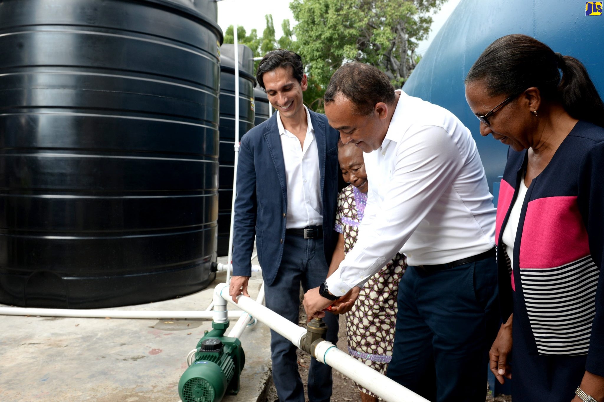 Health and Wellness Minister, Dr. the Hon. Christopher Tufton (second right), commissions 30 water tanks into service for the Kingston Public Hospital (KPH) and Victoria Jubilee Hospital (VJH) at the facilities
