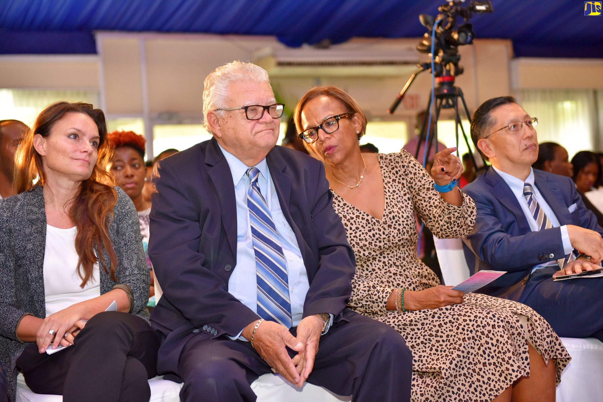 Minister without Portfolio in the Ministry of Education, Youth and Information, Hon. Karl Samuda (second left), listens to Inter-American Development Bank Country Representative for Jamaica, Therese Turner-Jones (second right), at the launch of the ‘1st 1000 Days’ App, on Tuesday (November 19), at the Terra Nova All-Suite Hotel in Kingston. The app was developed by the Early Childhood Commission (ECC), with funding provided by the United Nations Children’s Fund (UNICEF). Also pictured are Parenting Support Consultant, UNICEF, Ytske Van Winden (left); and Ambassador of Japan to Jamaica, His Excellency Hiromasa Yamazaki.