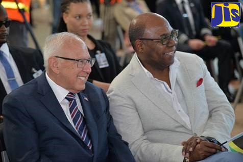 Minister of Tourism, Hon Edmund Bartlett (right) shares a light moment with United States Ambassador, His Excellency Donald Tapia.  Occasion was a reception to welcome American Airlines' daily nonstop service from New York’s John F Kennedy Airport to Montego Bay, at the Sangster International Airport on November 21.