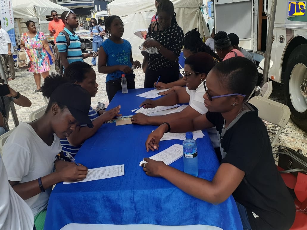 Members of the Kiwanis Club of Montego Bay (right) register participants during the organisation’s fifth annual Diabetes Awareness Health Fair, which was held in Sam Sharpe Square, St. James, on November 2.