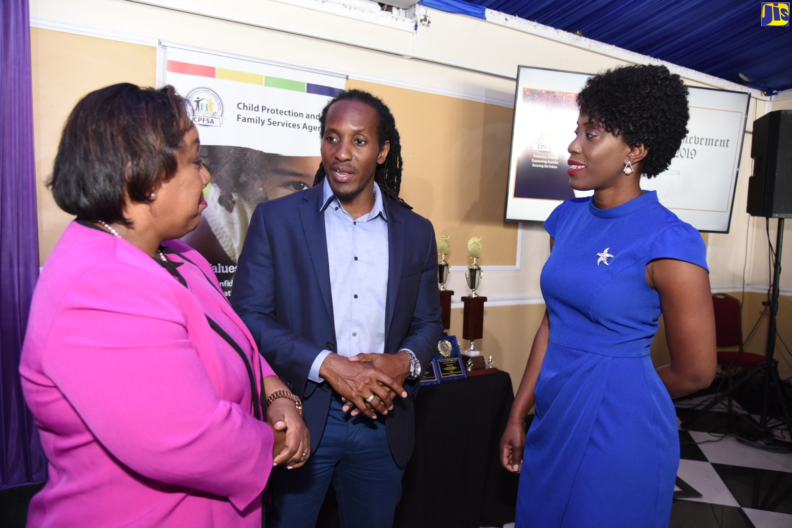 State Minister, Ministry of Education, Youth and Information, Hon. Alando Terrelonge (centre), speaks with Chief Executive Officer, Child Protection and Family Services Agency (CPFSA), Rosalee Gage-Grey (left), and Administrative Assistant at CPFSA and former ward of the State, Tanisha Esman Ledgister. Occasion was the CPFSA’s eighth annual Educational Achievement Awards Ceremony on Thursday (Nov. 28) at the Terra Nova Hotel, St. Andrew.