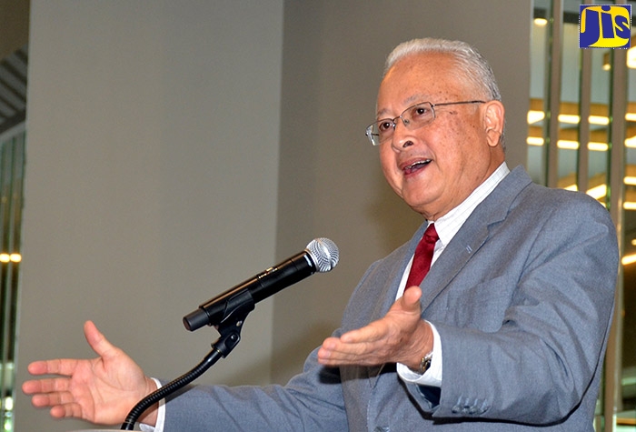 Minister of Justice, Hon. Delroy Chuck, addresses a Justice of the Peace sensitisation session at the AC Marriott Hotel, in Kingston, on December 13.
