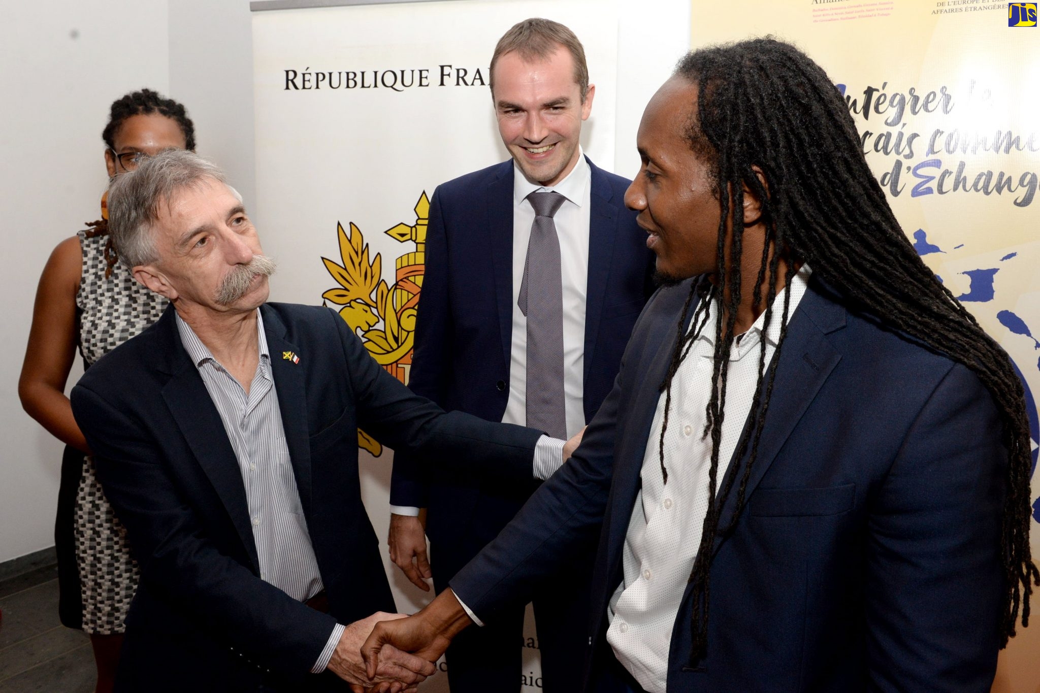 State Minister in the Ministry of Education, Youth and Information, Hon. Alando Terrelonge (right), is greeted by President of Alliance Francaise de la Jamaique,Pierre Lemaire, at the recent launch of the Integrate French as a Language of Exchange/Intégrer le Français comme Langue d