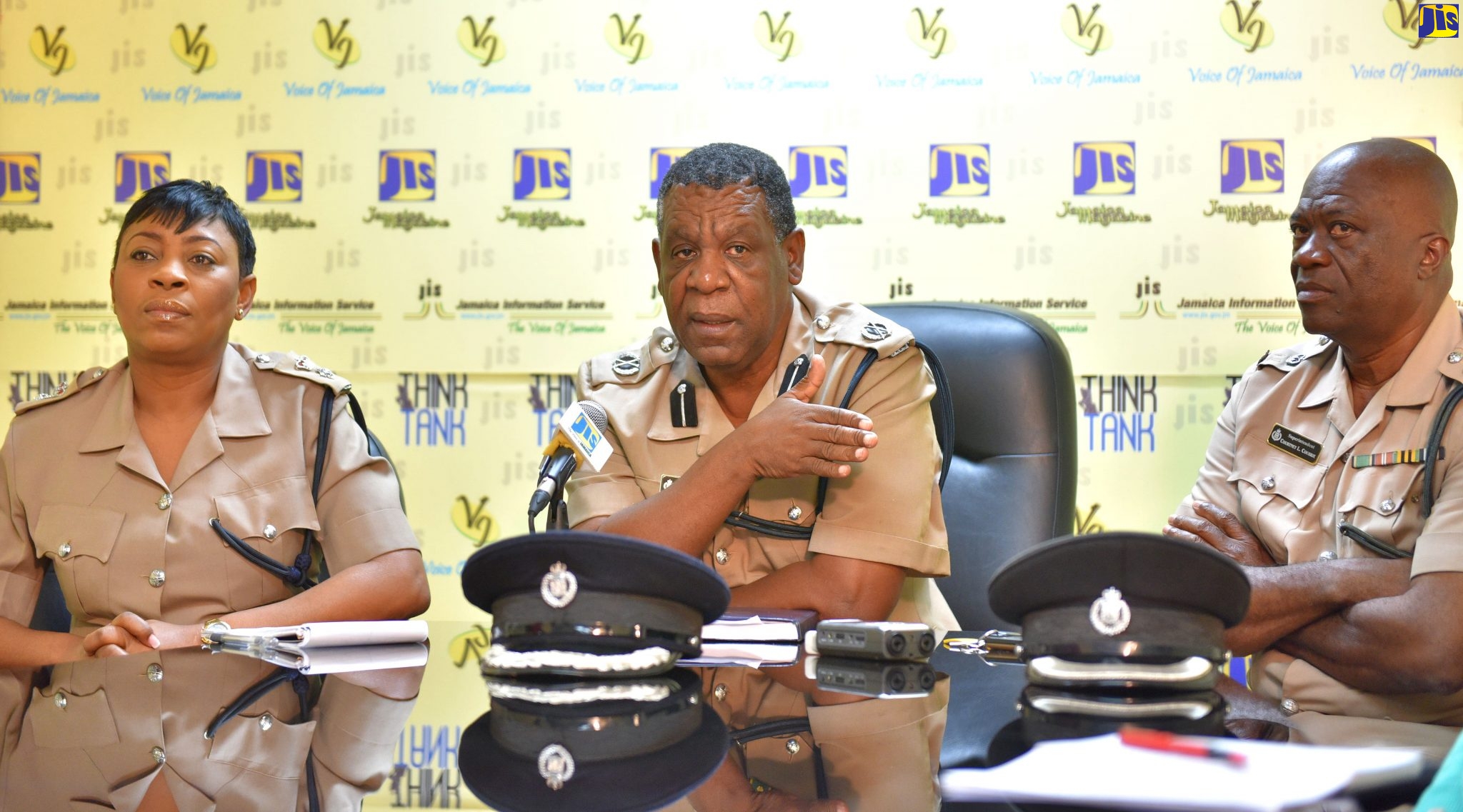 JCF3: Head of the Community Safety and Security Branch, Jamaica Constabulary Force (JCF), Assistant Commissioner of Police (ACP), Ealan Powell (centre), addresses a Jamaica Information Service (JIS) Think Tank on Wednesday (Dec. 18 ). He is flanked by Head of the Constabulary Communications Unit, Senior Superintendent of Police (SSP), Stephanie Lindsay (left), and Superintendent Courtney Coubrie of the Public Safety and Traffic Enforcement Branch.