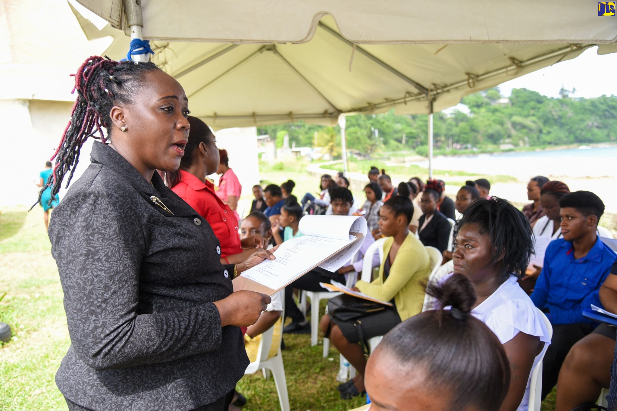 Divisional Director, Industrial Relations and Allied Services, Ministry of Labour and Social Security, Ms. Gillian Corrodus (left), offers words of encouragement to persons who attended the Ministry’s Eastern Roadshow at the Anglican Church Hall in Port Maria, St. Mary, on November 27.