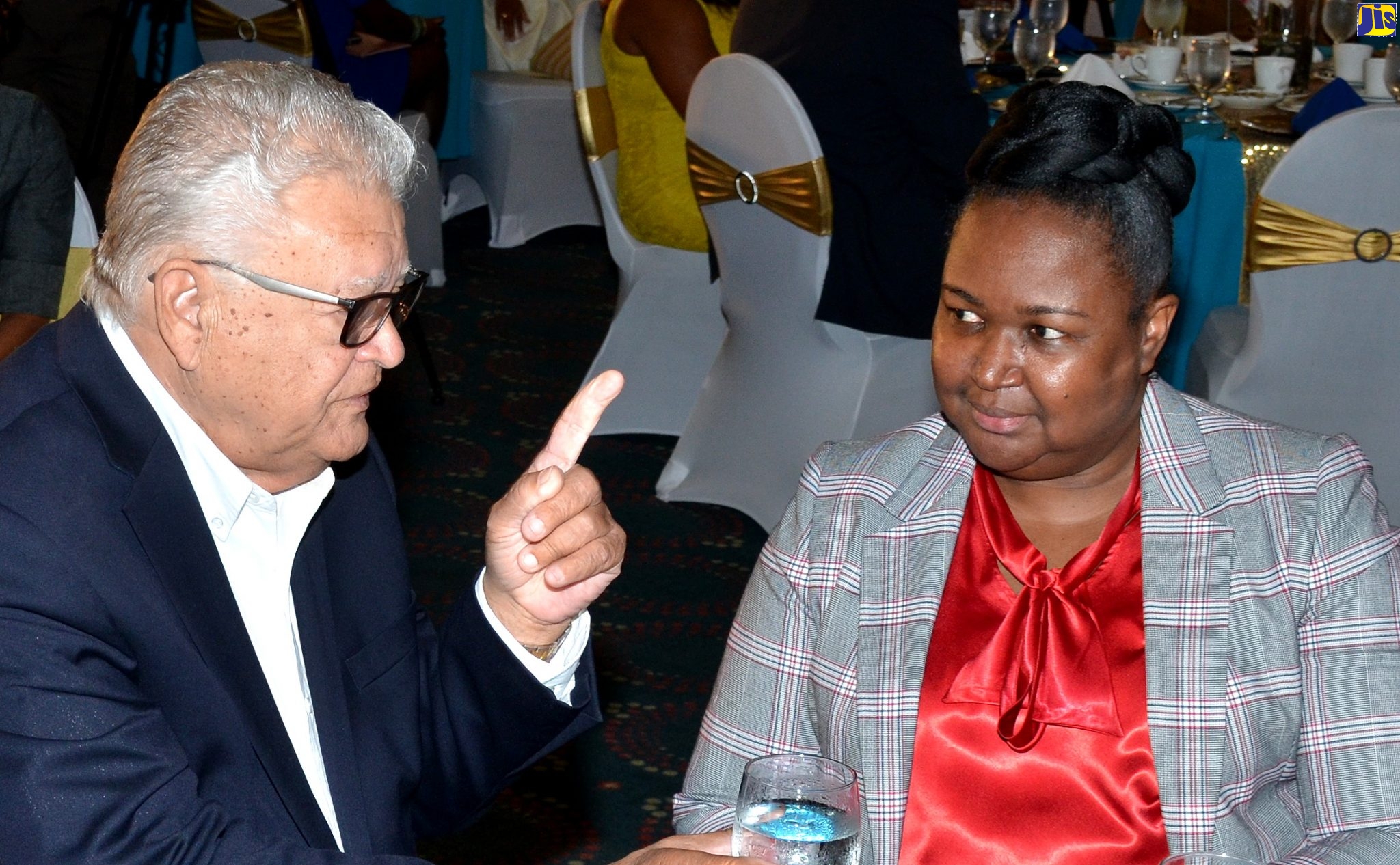 Minister without Portfolio with responsibility for Education, Youth and Information, Hon. Karl Samuda (left) shares in conversation with Acting Permanent Secretary, Ministry of Education, Youth and Information, Dr. Grace McLean, during the Ministry’s Annual Staff Recognition and Awards Ceremony held on Friday (November, 29) at the Jamaica Pegasus hotel in New Kingston.