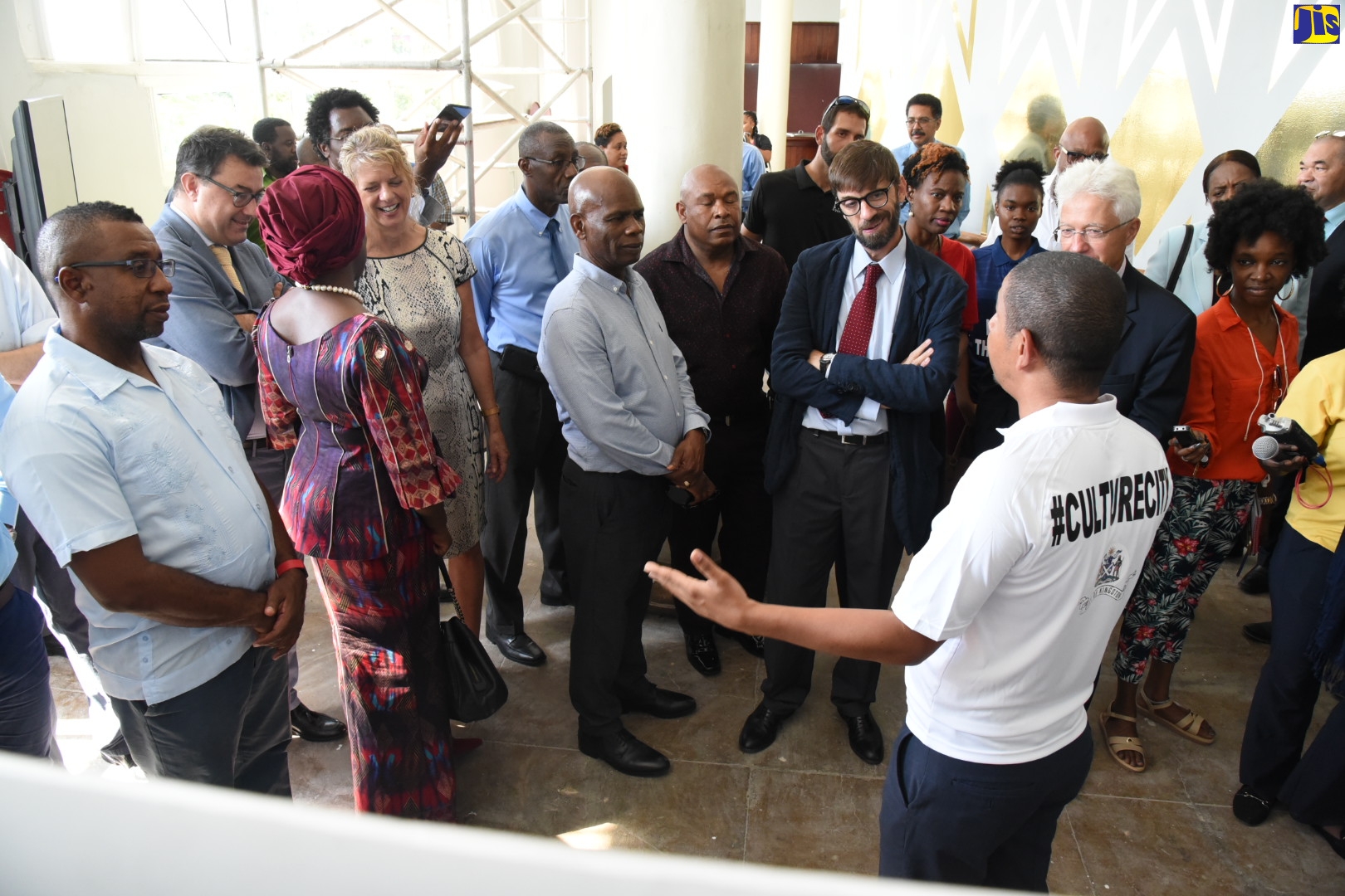 Mayor of Kingston, Senator Councillor Delroy Williams (right), gives an update on the Ward Theatre restoration project to members of the diplomatic corps, agency officials and stakeholders in the creative industry, during a tour of the downtown Kingston venue on Wednesday (December 4).