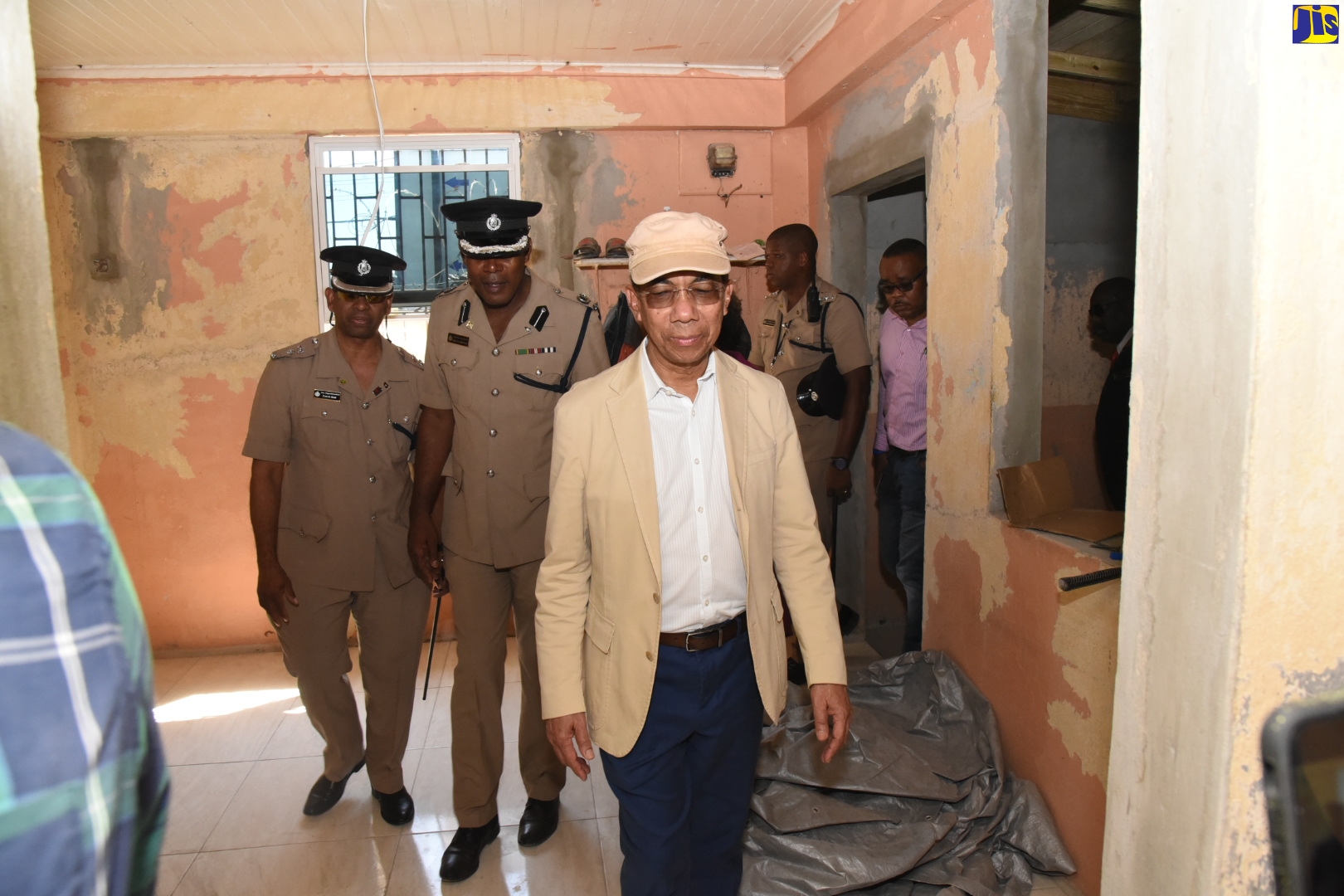 Minister of National Security, Hon. Dr. Horace Chang (foreground); Senior Superintendent of Police, Clive Blair (left); and Assistant Commissioner of Police, Gary Griffiths (second left), tour the Old Harbour Police Station in St. Catherine, on January 24.