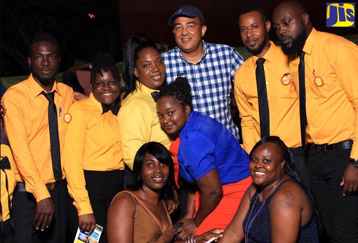 Member of Parliament for West Central St. Catherine, Dr. the Hon. Christopher Tufton (fourth  left, back row), with members of the Cherry Youth Society at a special function organised by the group to honour public servants in St. Catherine, on January 1.