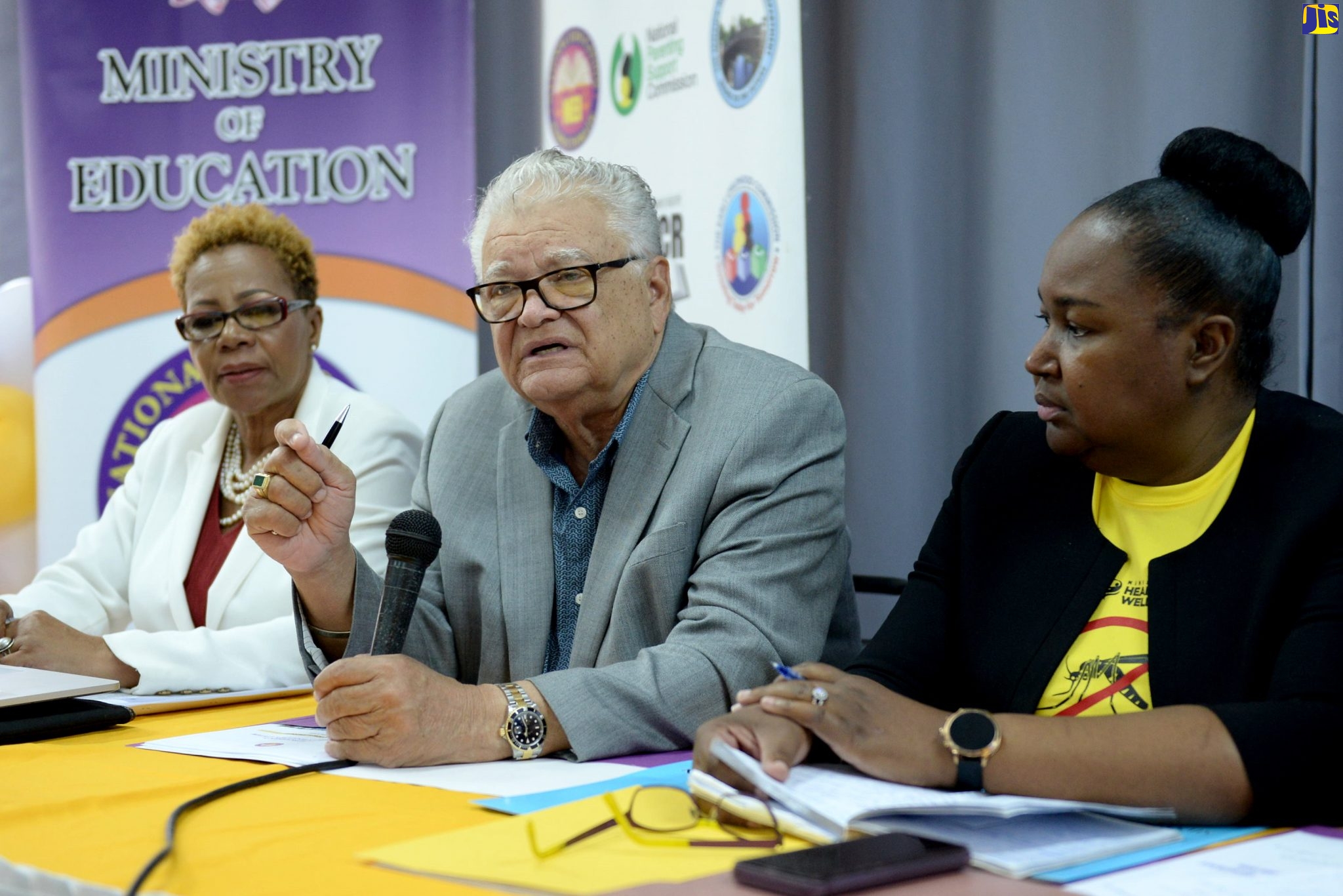 Minister with responsibility for Education, Youth and Information, Hon. Karl Samuda (centre), addresses a press conference on the findings of the National Education Inspectorate (NEI) Report, at the Pembroke Hall High School in Kingston on Friday (January 24). Listening are Acting Permanent Secretary in the Ministry, Dr. Grace McLean (right); and Chief Inspector at the NEI, Maureen Dwyer.