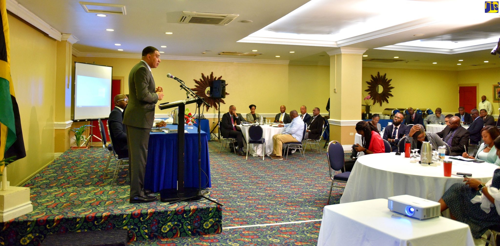 Prime Minister, the Most Hon. Andrew Holness (at podium), addresses heads of agencies with responsibility for the water, housing and infrastructure portfolios of the Ministry of Economic Growth and Job Creation, during a meeting at The Knutsford Court Hotel in New Kingston on Wednesday (January 8).
