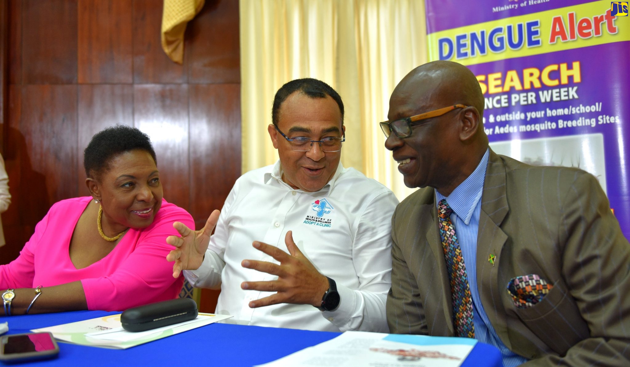 Minister of Health and Wellness, Dr. the Hon. Christopher Tufton (centre), in discussion with Minister of Culture, Gender, Entertainment and Sport Minister, Hon. Olivia Grange (left) and Minister of Local Government and Community Development, Hon. Desmond McKenzie, at yesterday’s (January 15) post-Cabinet press briefing, at Jamaica House.
