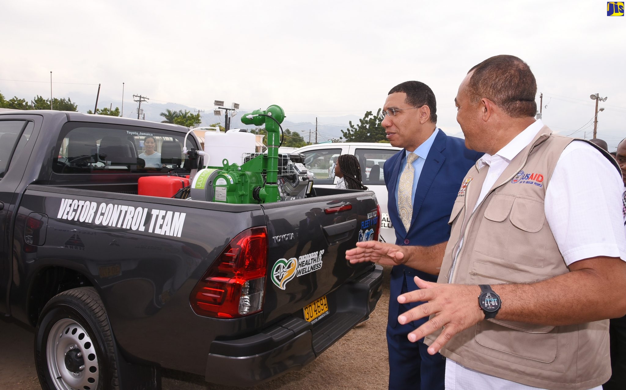 Prime Minister, the Most Hon. Andrew Holness (left), and Minister of Health and Wellness, Dr. the Hon. Christopher Tufton, examine one of the newly acquired vector-control vehicles with mounted fogger, during the unveiling ceremony at the Ranny Williams Entertainment Centre in St. Andrew on January 27. A total of 50 vehicles were unveiled at the function. The vehicles will be given to the four regional health authorities to enhance their fogging activities across the island.