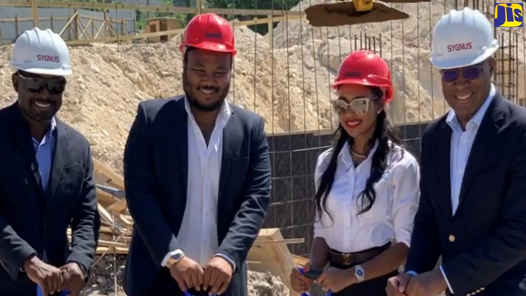 Developers, Matthew Donaldson (second left) and his wife, Danielle (third left), at the construction site of their $600-million housing project in Ironshore, St. James. Others (from left) are Financiers, Sygnus Group Co-founder, Ike Johnson, and head of Sygnus Group Real Estate, David Cummings.