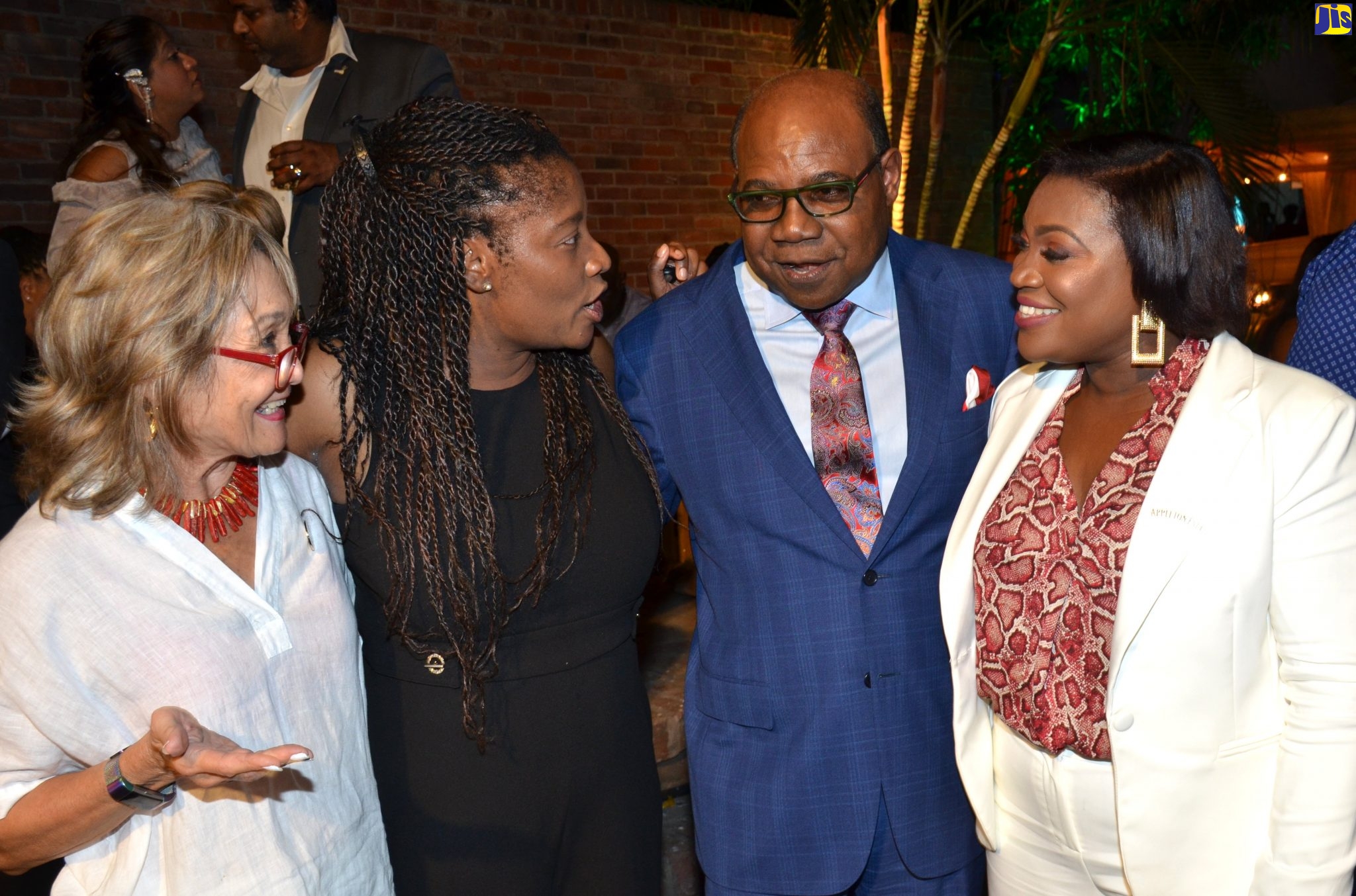 Minister of Tourism, Hon. Edmund Bartlett (second right), converses with (from left) Chief Executive Officer of Island Grill, Thalia Lyn; Senior Director of Public Affairs at J. Wray and Nephew, Tanikie McLarty Allen; and Director of Marketing at J. Wray and Nephew, Marsha Lumley, at the Rum Festival launch on January 15 at Devon House in Kingston.