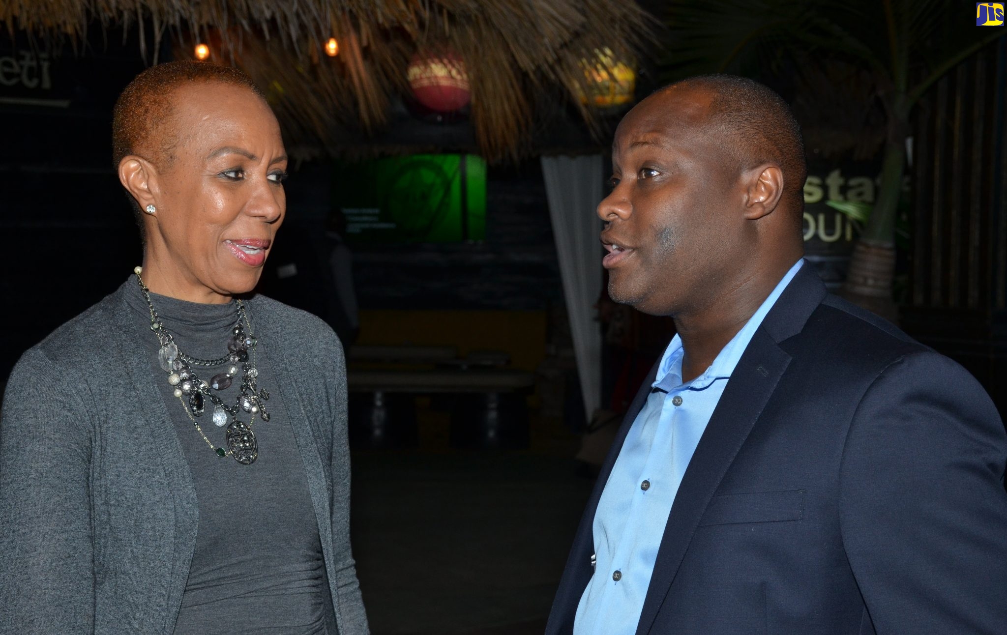 Science, Energy and Technology Minister, Hon. Fayval Williams (left), converses with Chief Executive Officer, eGov Jamaica Limited (eGovja), Maurice Barnes, at the entity