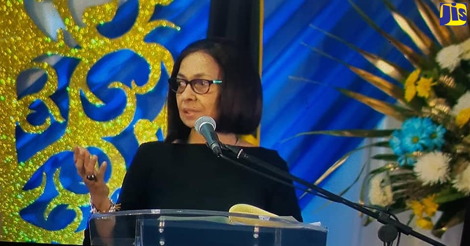 Minister of Labour and Social Security, Hon. Shahine Robinson, addressing a recent awards dinner for overseas farm and hospitality workers at the Melia Braco Resort in Trelawny.