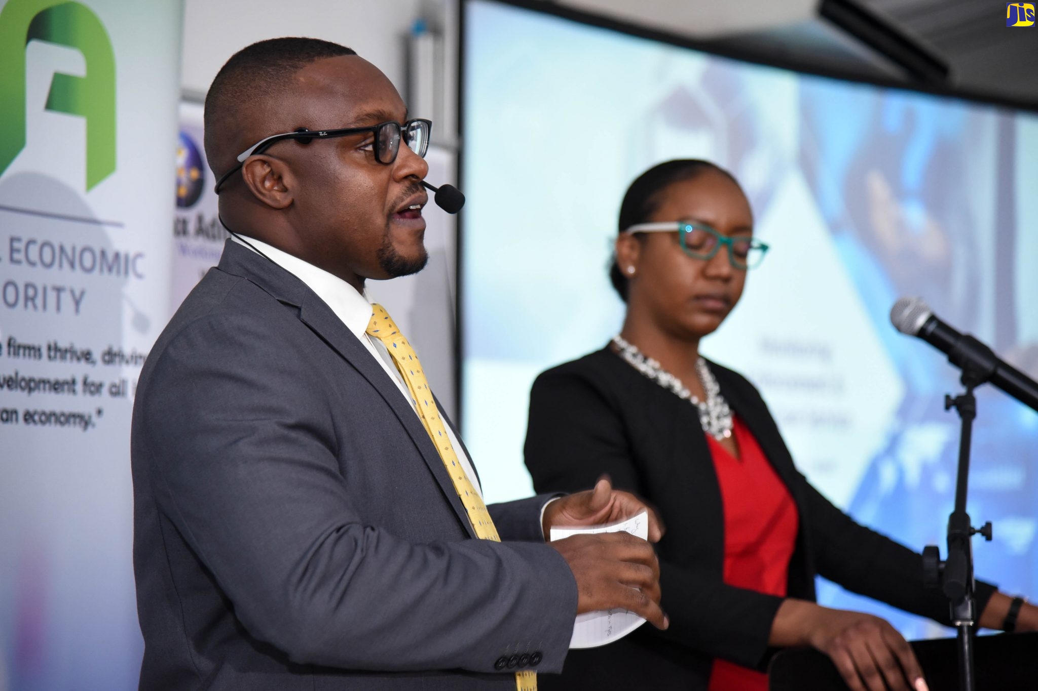 Senior Director, Regulations, Policy, Enforcement and Monitoring, Jamaica Special Economic Zone Authority (JSEZA), Ainsley Brown (left), explains the importance of monitoring special economic zones (SEZs) during a recent sensitisation session, held at the Spanish Court Hotel, in Kingston. At right Senior Director, Business Partner Support Services, JSEZA, Licia Grant.