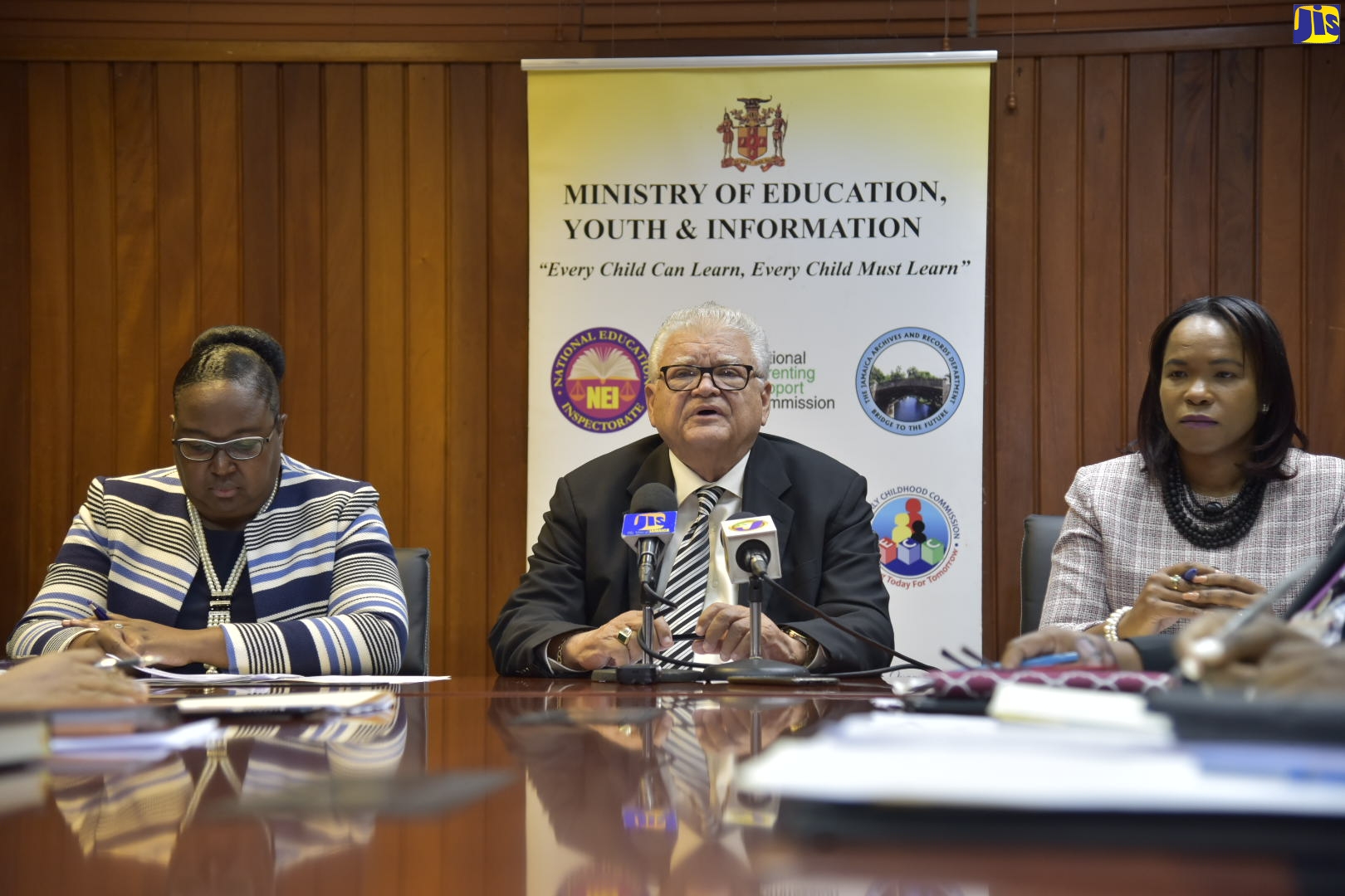 Minister with responsibility for Education, Youth and Information, Hon. Karl Samuda (centre), addressing journalists during a media briefing at the Ministry’s offices in Kingston on Thursday (February 13). He is flanked by Acting Permanent Secretary in the Education Ministry, Dr. Grace McLean (left); and Acting Chief Education Officer, Dr. Kasan Troupe.