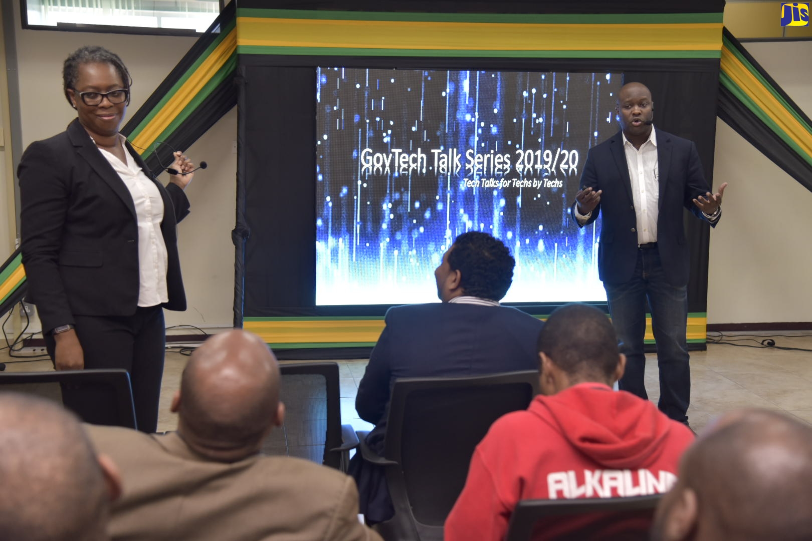 Chief Executive Officer, eGov Jamaica Limited, Maurice Barnes (right), makes a presentation at an information session, ‘GovTechTalk’,  hosted by the company at its Old Hope Road address in Kingston, on Friday, January 31.  At left is  Head of the Cyber Incident Response Team (CIRT), Dr. Moniphia Hewling.