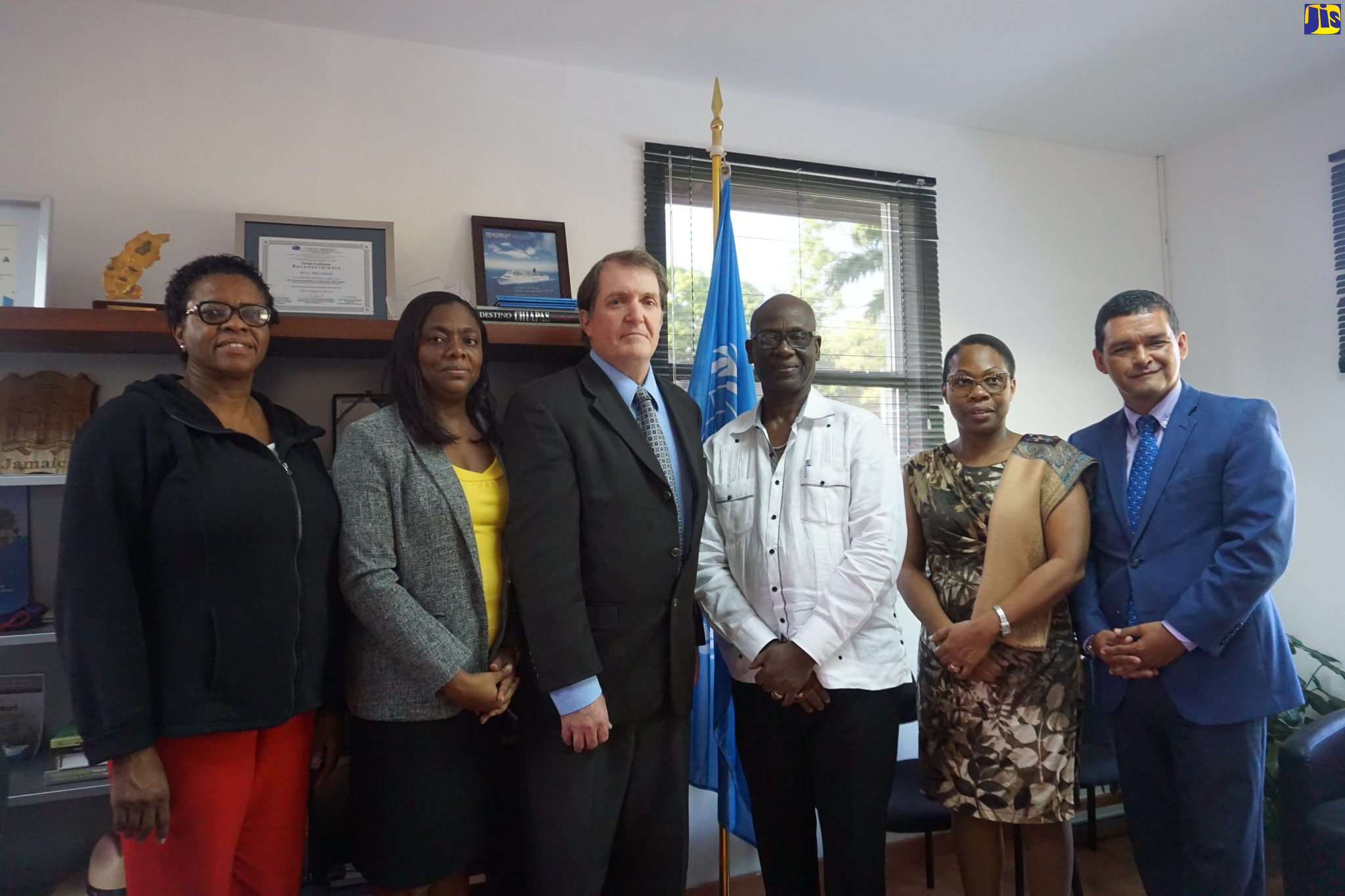 Minister of Local Government and Community Development, Hon. Desmond McKenzie (third right); Regional Coordinator for the United States Agency for International Development (USAID) Office of US Foreign Disaster Assistance (OFDA), Timothy Callaghan (third left); and Chief of the UNDRR Regional Office, Raul Salazar, share a photo opportunity with members of the local planning team for the seventh Regional Platform for Disaster Risk Reduction in the Americas and the Caribbean. Occasion was a meeting with partners and stakeholders at the United Nations Office for Disaster Risk Reduction (UNDRR) Regional Office in Panama on February 5.  From left are Director of Information and Training at the Office of Disaster Preparedness and Emergency Management (ODPEM), Delmares White; Principal Finance Officer in the Local Government Ministry, Anneisha Gordon-McFarlane; and Permanent Secretary in the Ministry, Marsha Henry-Martin.