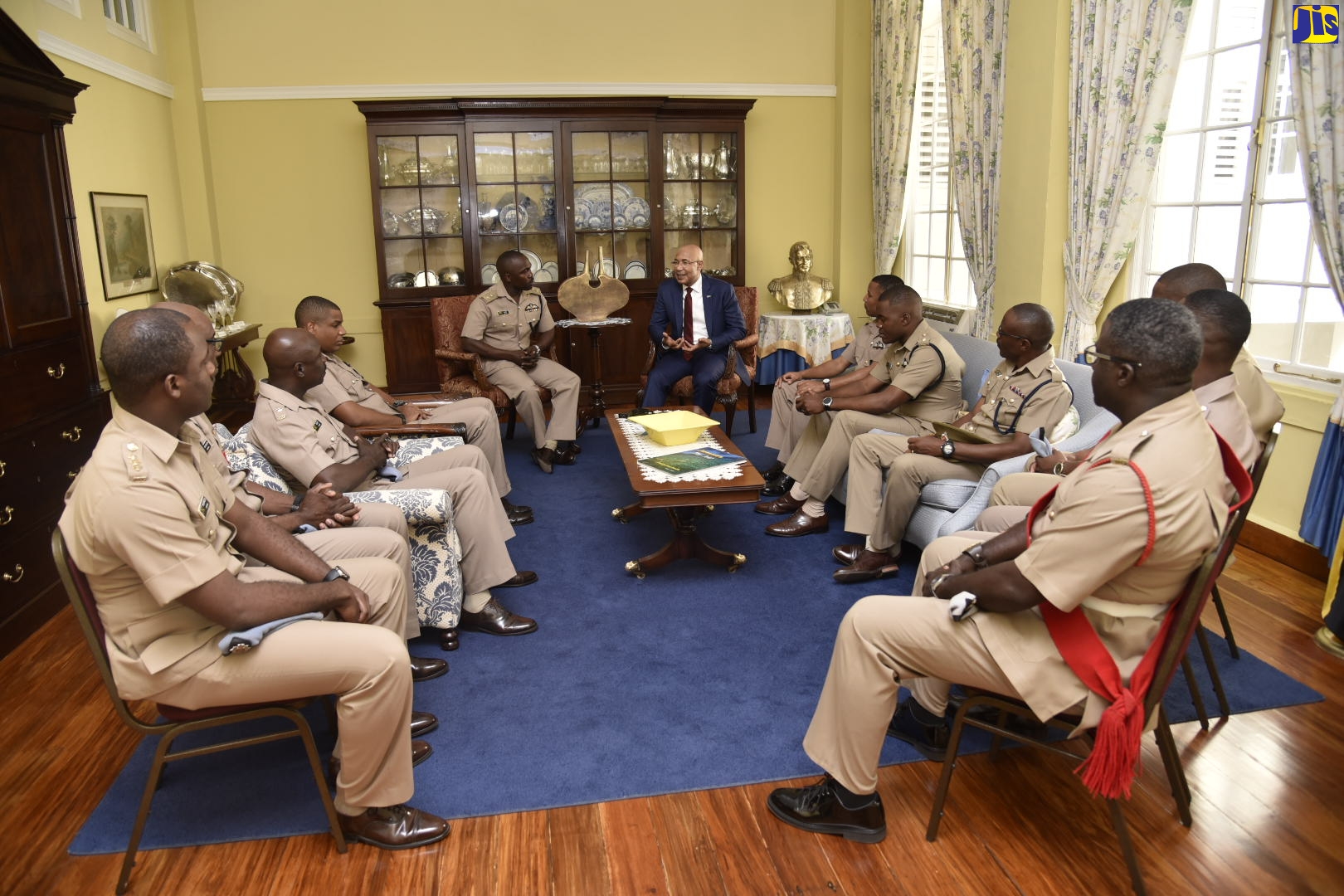 Governor-General, His Excellency, the Most Hon. Sir Patrick Allen (sixth left), converses with Commanding Officer  of the Jamaica Defence Force (JDF) Air Wing, Lieutenant Colonel Brian Lumdi (fifth left), and members of the Unit’s Officer Corps, during their visit to  King’s House, on February 21.
