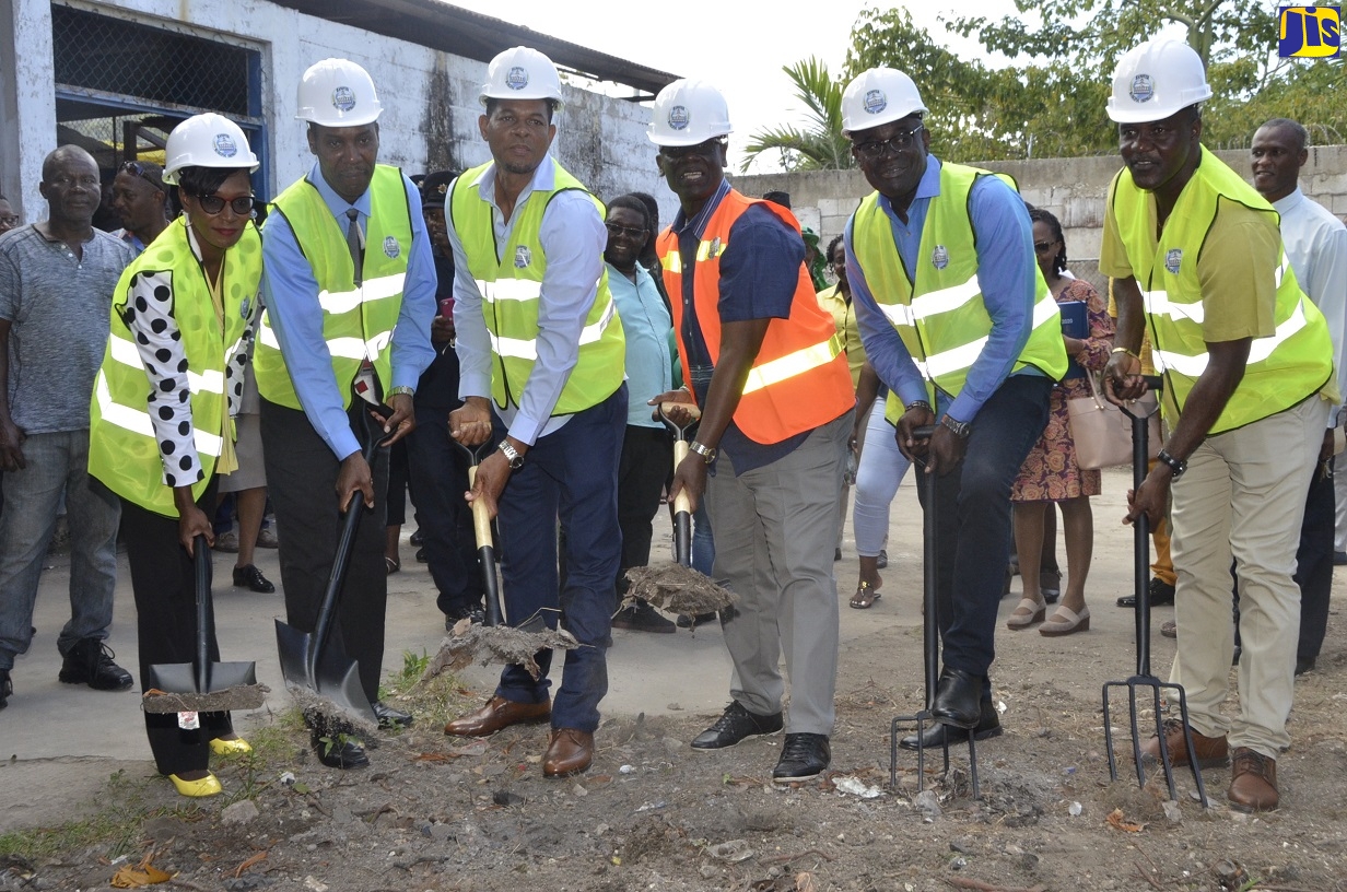 Minister of Local Government and Community Development, Hon. Desmond McKenzie (3rd right), breaks ground for the rehabilitation of the Hopewell Market in Hanover. Others (from left) are: Deputy Mayor of Lucea, Andria Dehaney; Chief Executive Officer (CEO) at the Hanover Municipal Corporation, David Gardner; Member of Parliament for Hanover Eastern, Dave Brown; Mayor of Hanover, Sheridan Samuels; and Councillor for the Hopewell Division, Devon Brown.