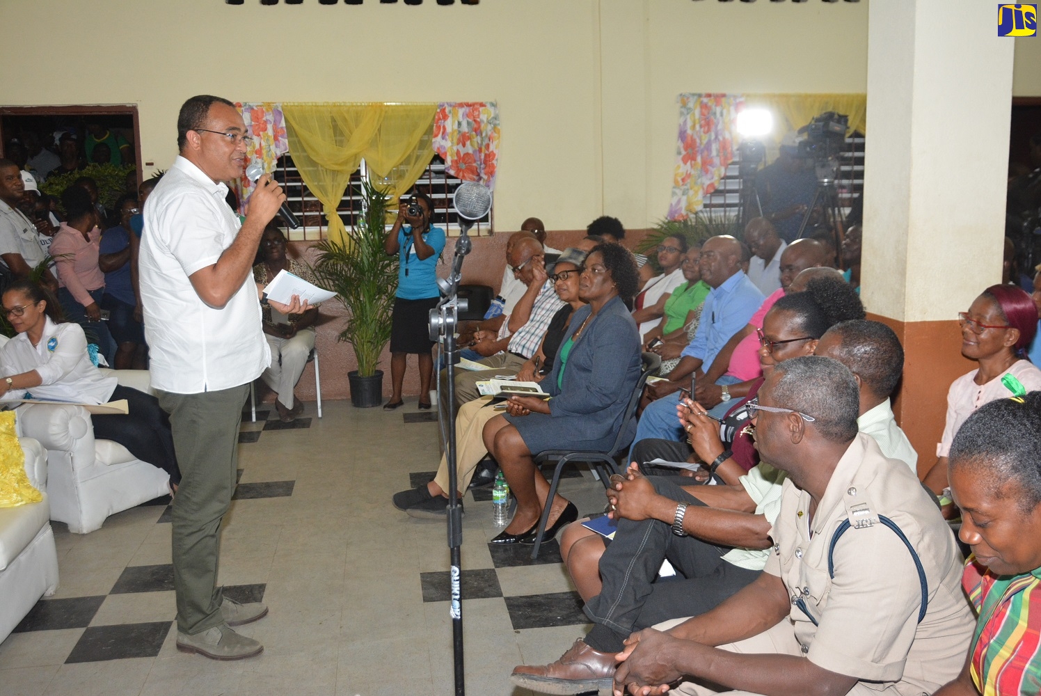 Minister of Health and Wellness, Dr. the Hon. Christopher Tufton, addressing residents at a town hall meeting held at the Charlton Primary School in Alexandria, St. Ann, on Friday, February 21.